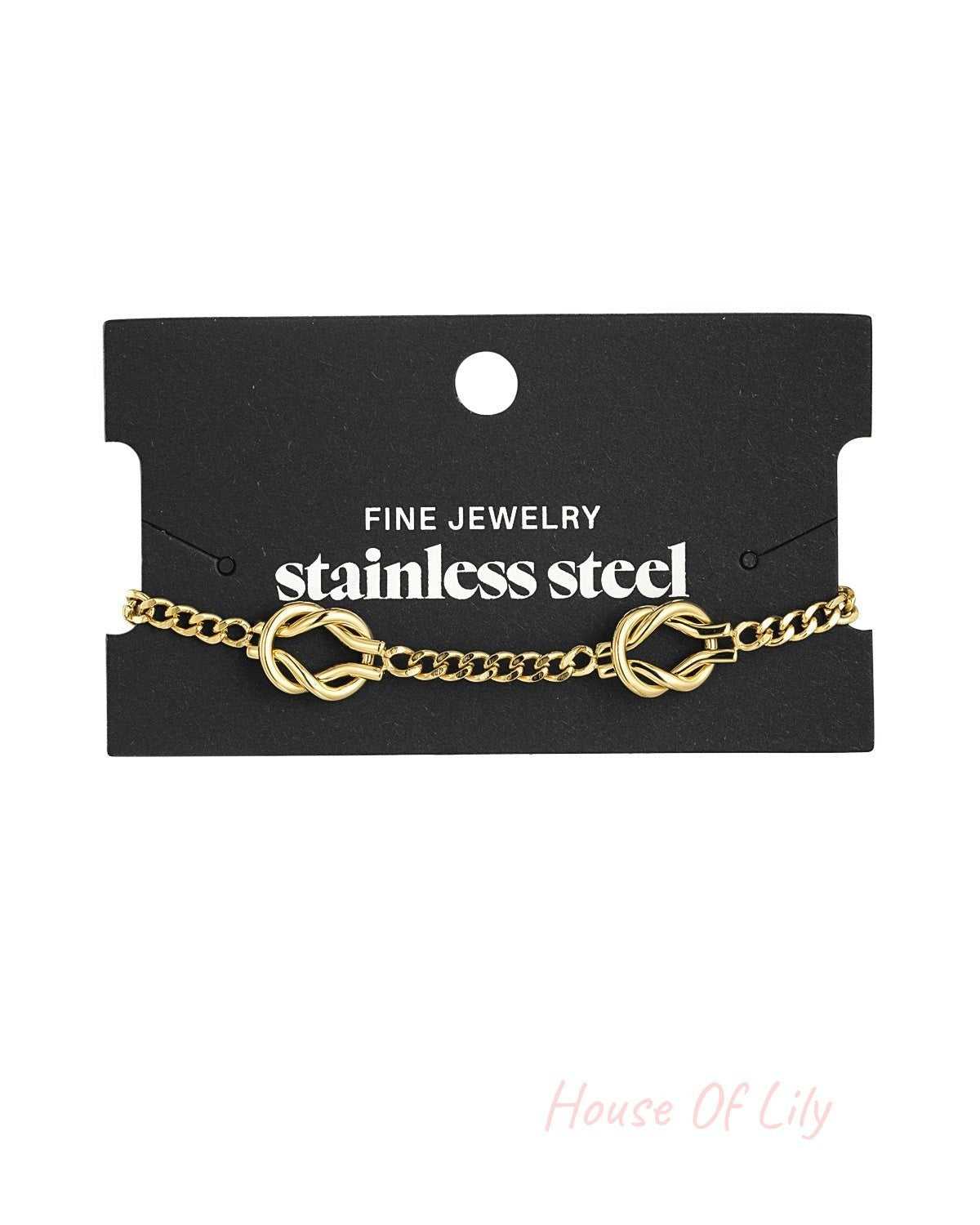 Gold knot bracelet displayed on black fine jewelry card with stainless steel branding