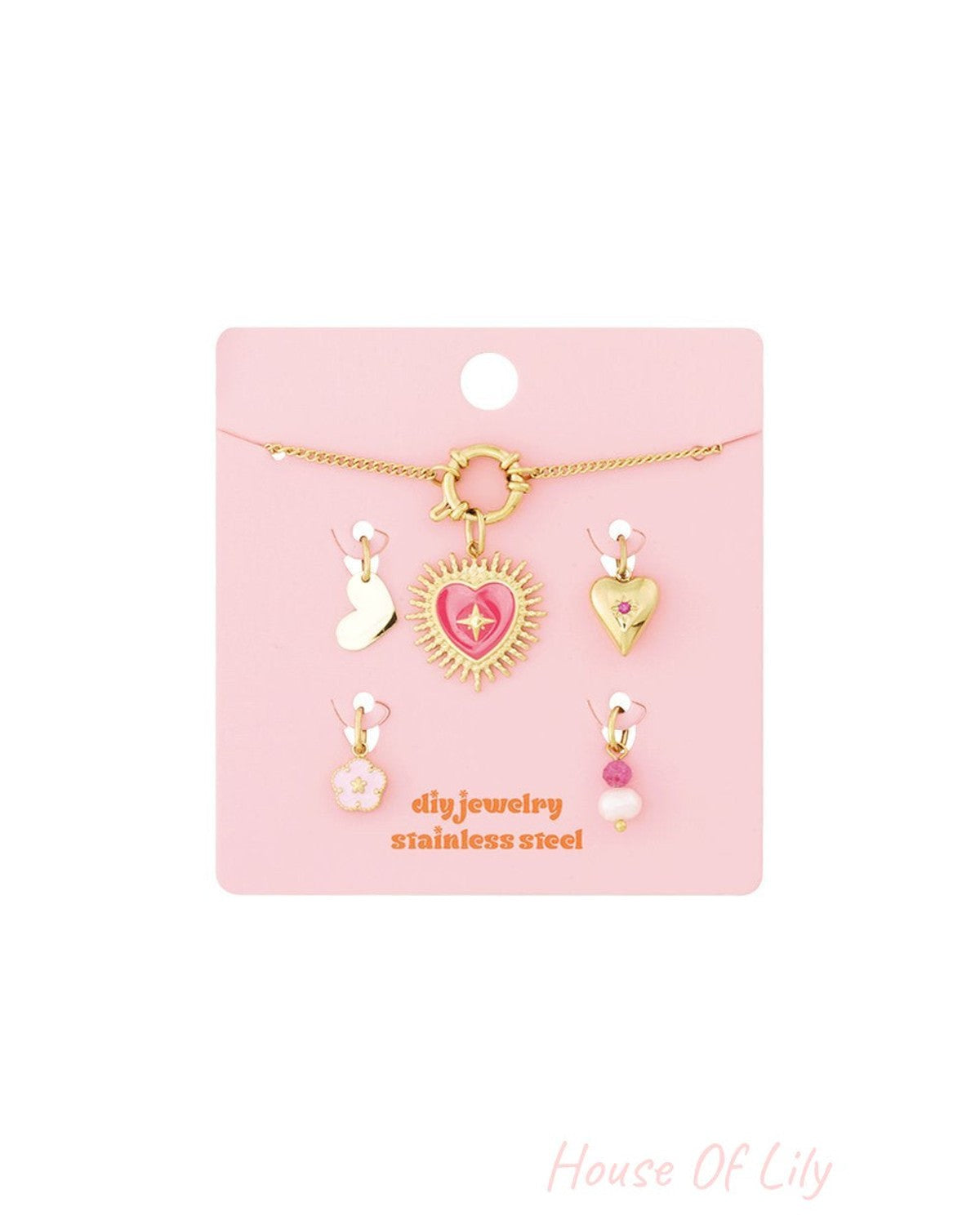 Sculpted Gold Charm Set III: A gold chain with a pink heart pendant and four assorted dainty heart, floral, and bead charms.