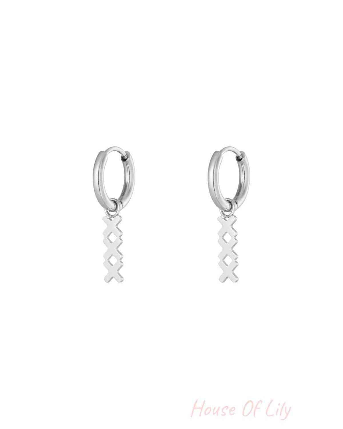 Pair of silver geometric hoop drop earrings with the same interlocking X pendant on a white background