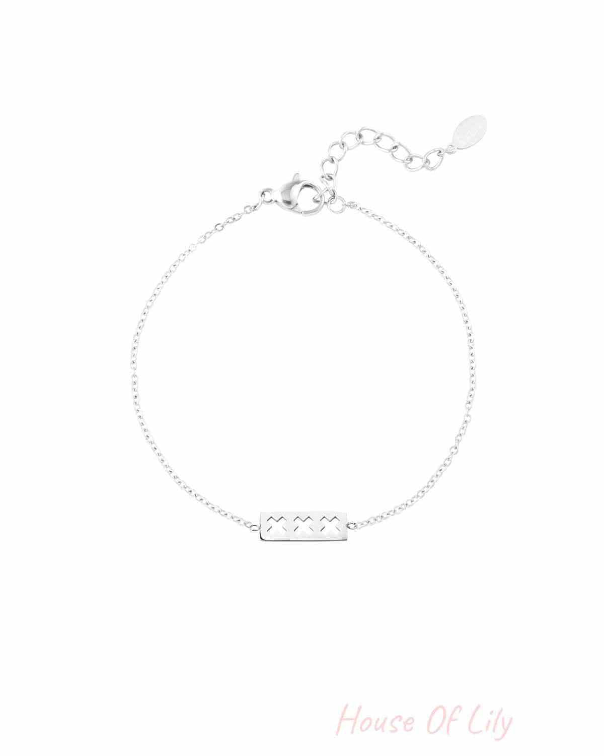 Silver triple X minimalist bracelet with adjustable chain and lobster clasp shown on white background