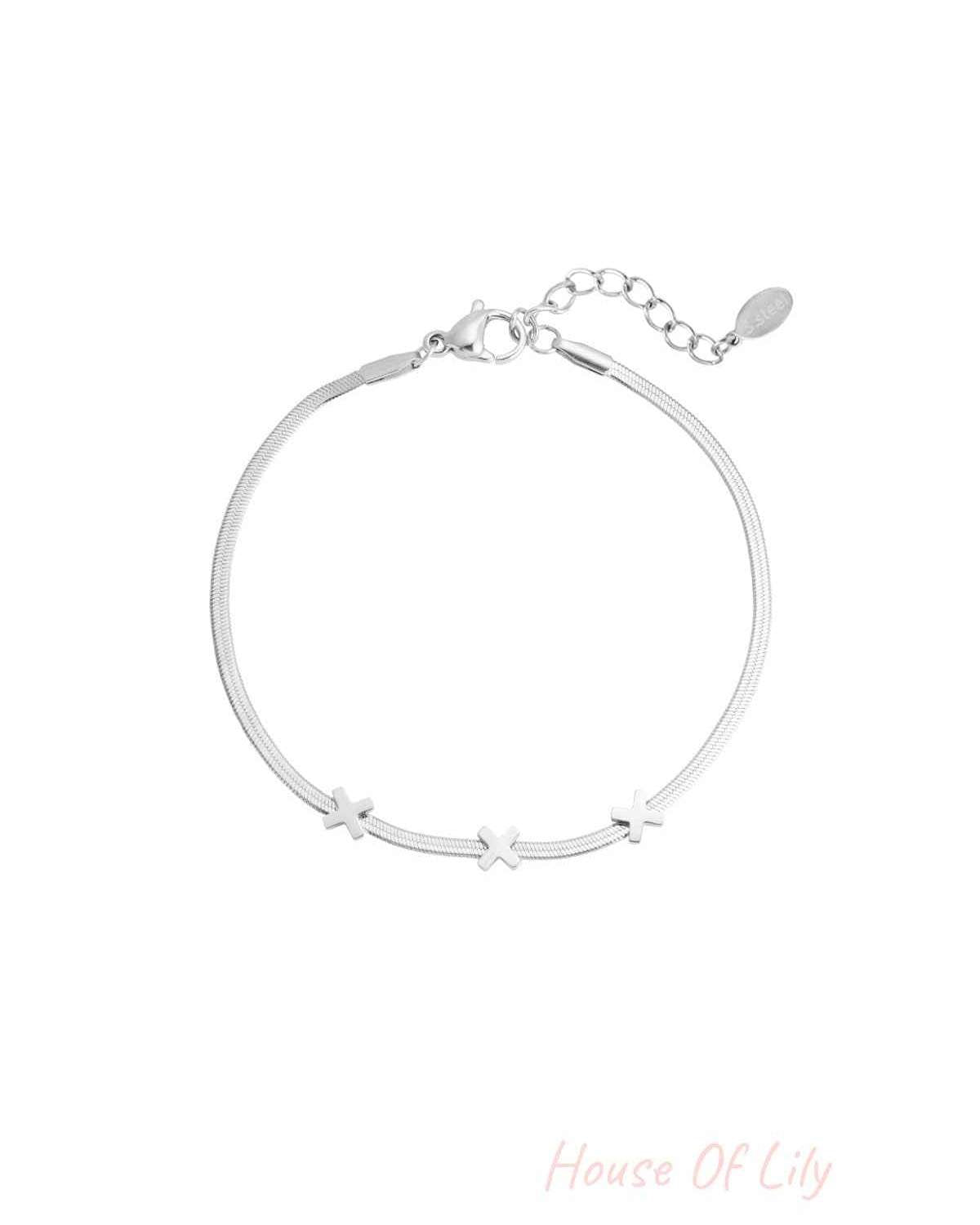 Silver triple X charm bracelet with smooth chain and lobster clasp on white background