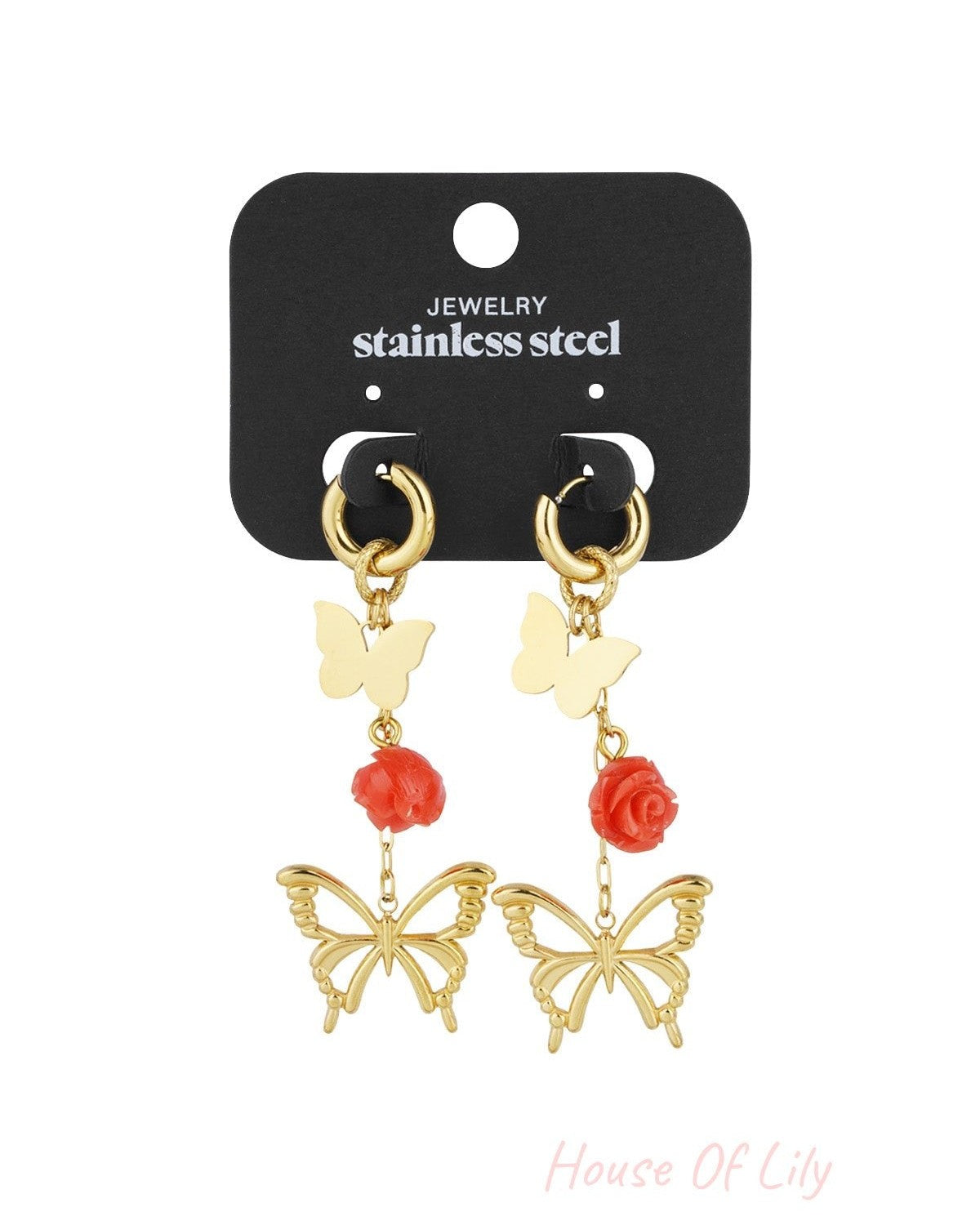 Gold butterfly and rose drop earrings displayed on black card labeled stainless steel