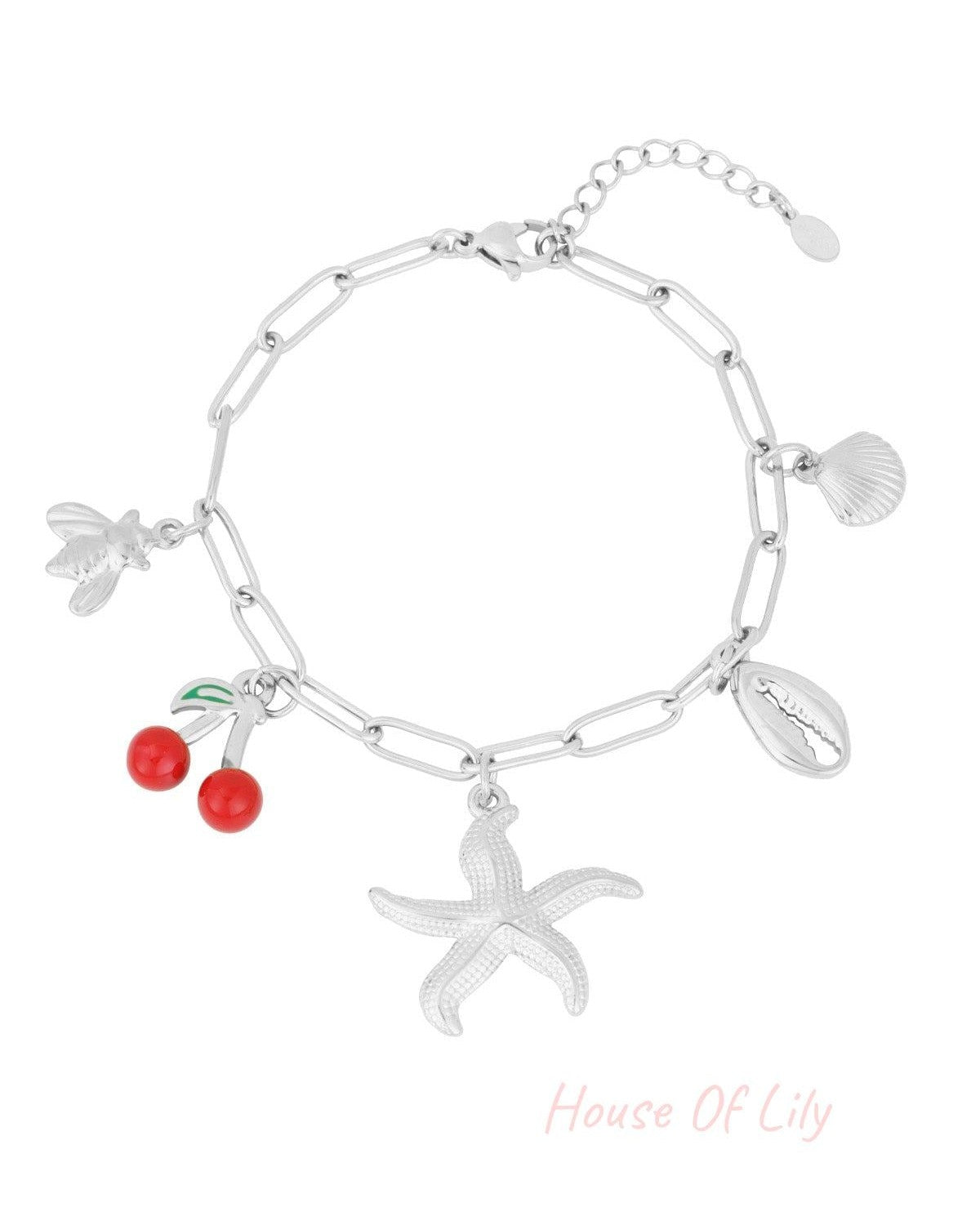 Silver charm bracelet with the same beach-themed charms displayed on a white background