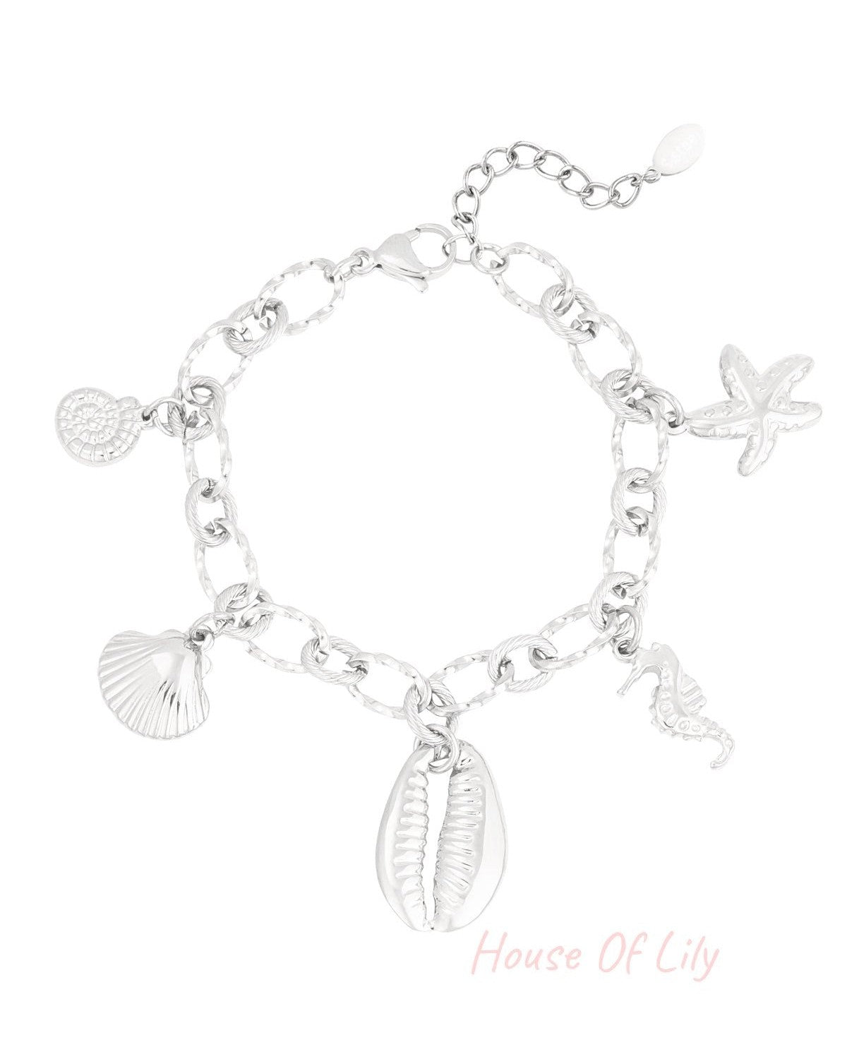 Silver-tone charm bracelet with large textured links and sea-themed charms including starfish, seahorse, shell, and cowrie shell on a white background.