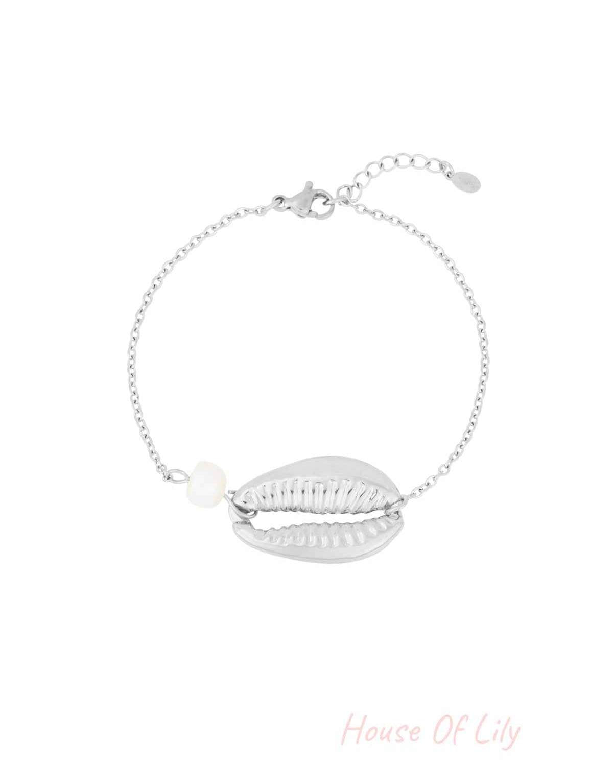 Silver-tone version of the shell charm bracelet with pearl detail on a white background