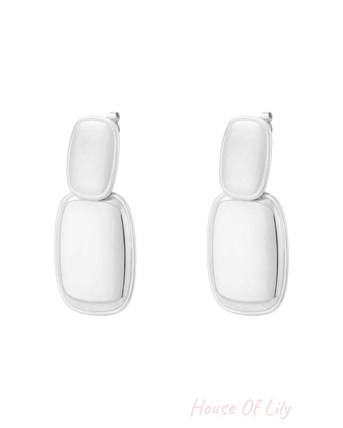 Pair of modern double drop earrings in shiny silver with two stacked rectangular shapes