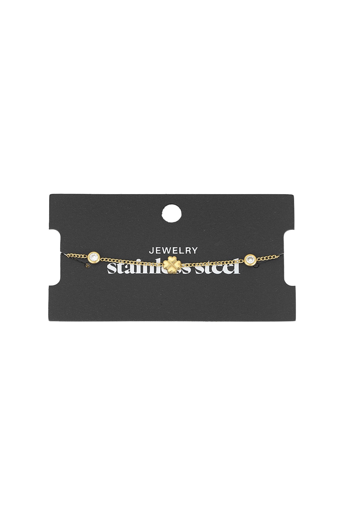 Gold four-leaf clover charm bracelet displayed on black jewellery packaging labeled stainless steel