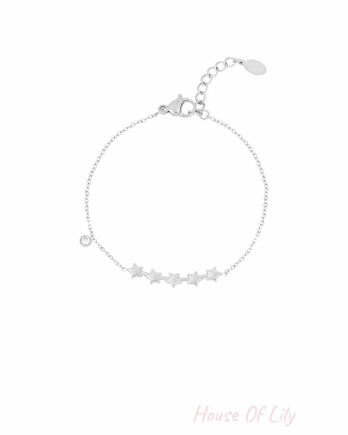 Silver star charm bracelet with five star charms and a small crystal accent on a fine chain with a lobster clasp
