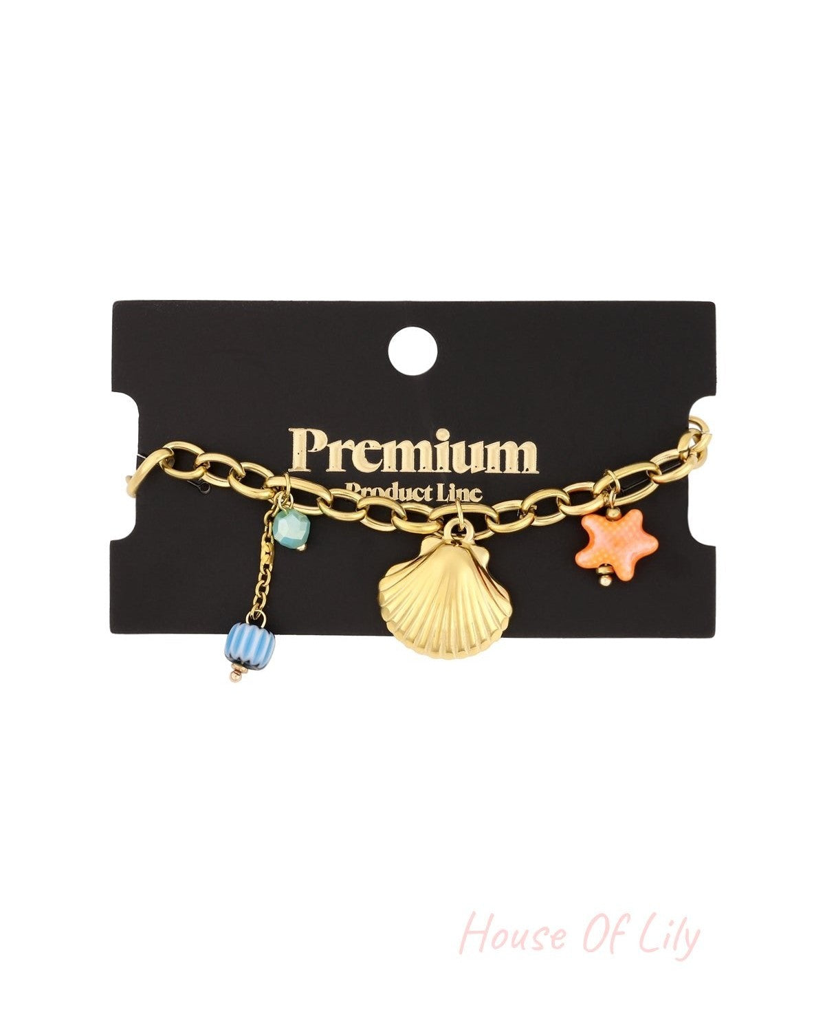 Gold charm bracelet displayed on black Premium Product Line card background ready for retail with all charms visible