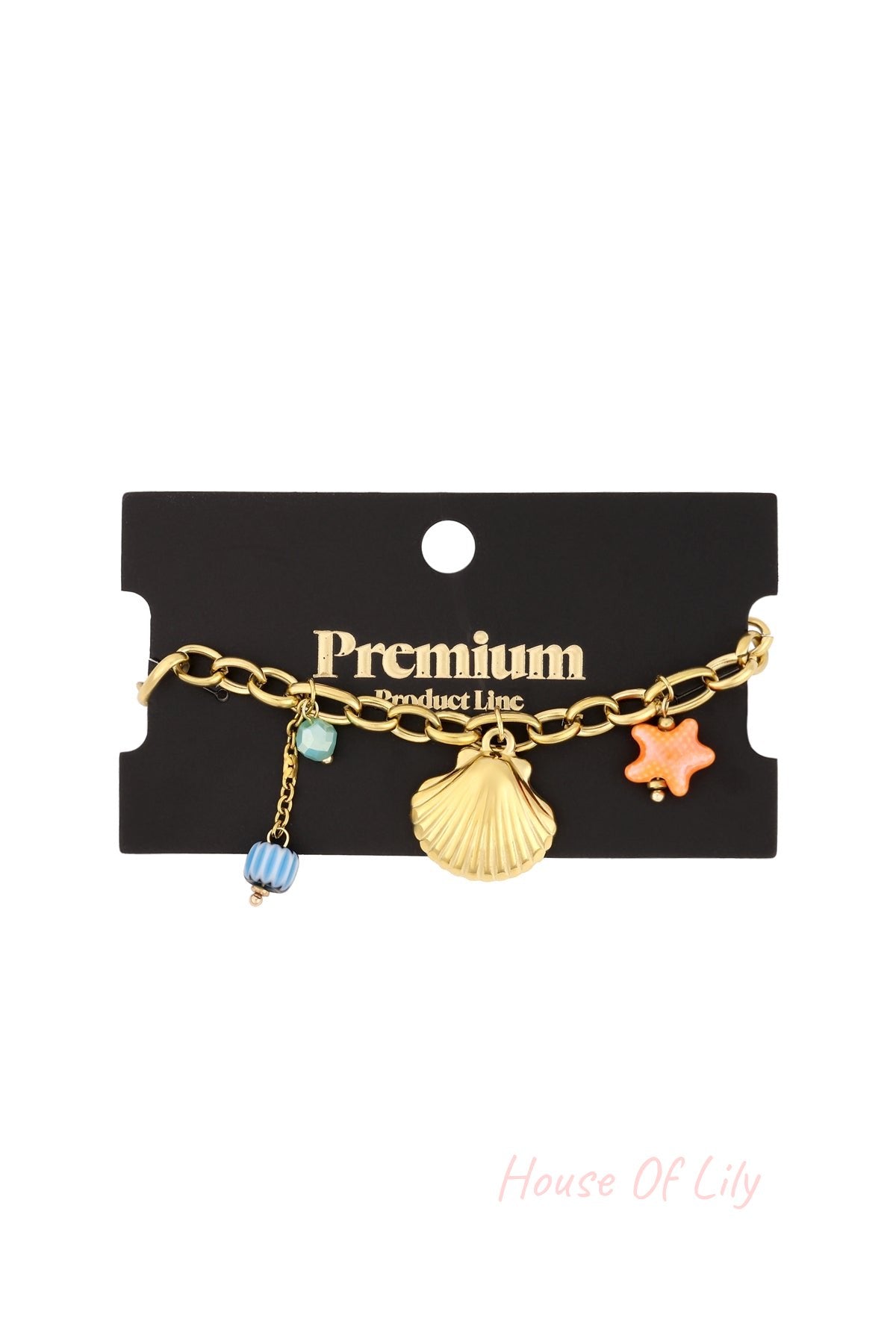 Gold charm bracelet displayed on black Premium Product Line card background ready for retail with all charms visible
