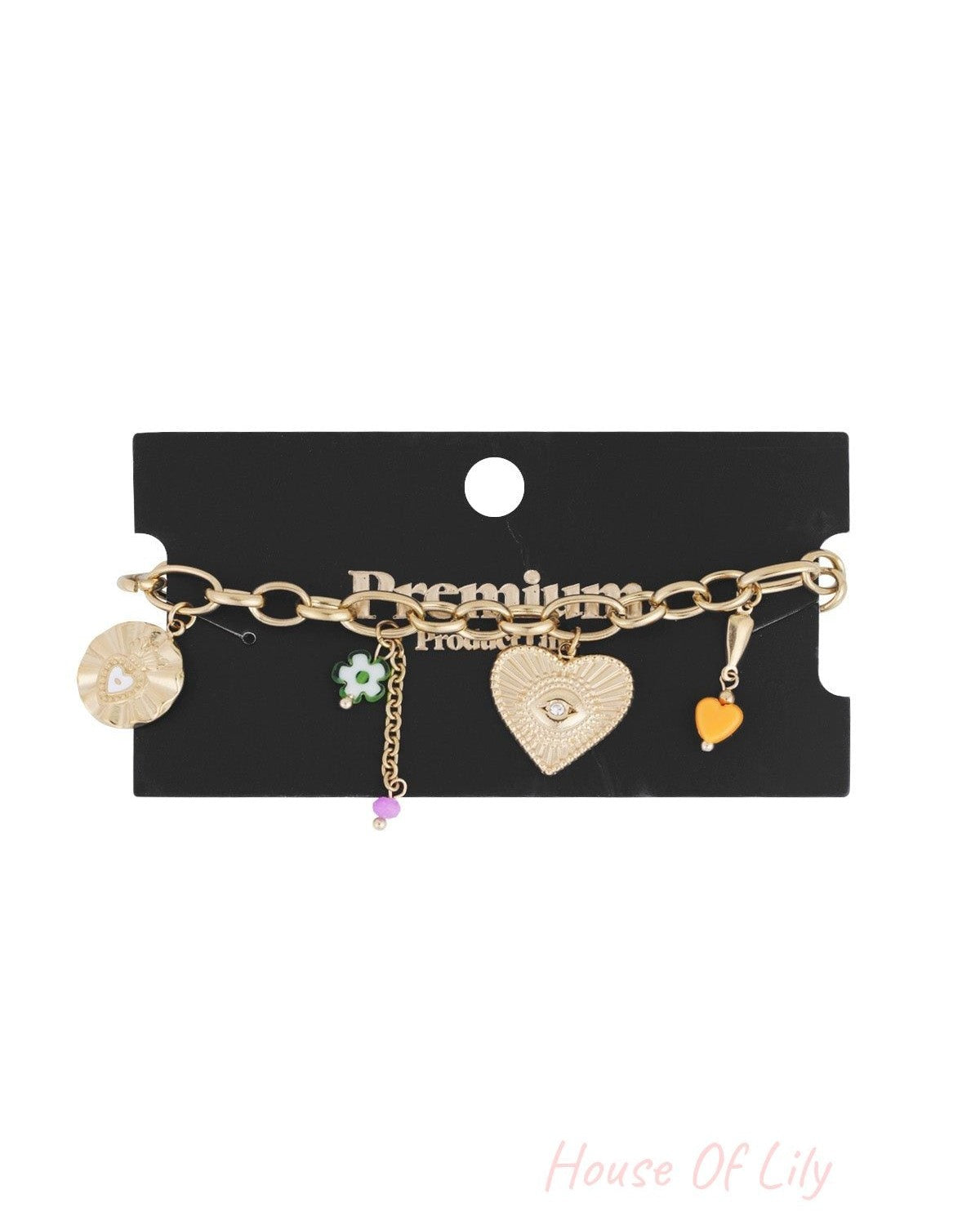 Gold charm bracelet displayed on black card packaging labelled Premium Products, showing all charms clearly
