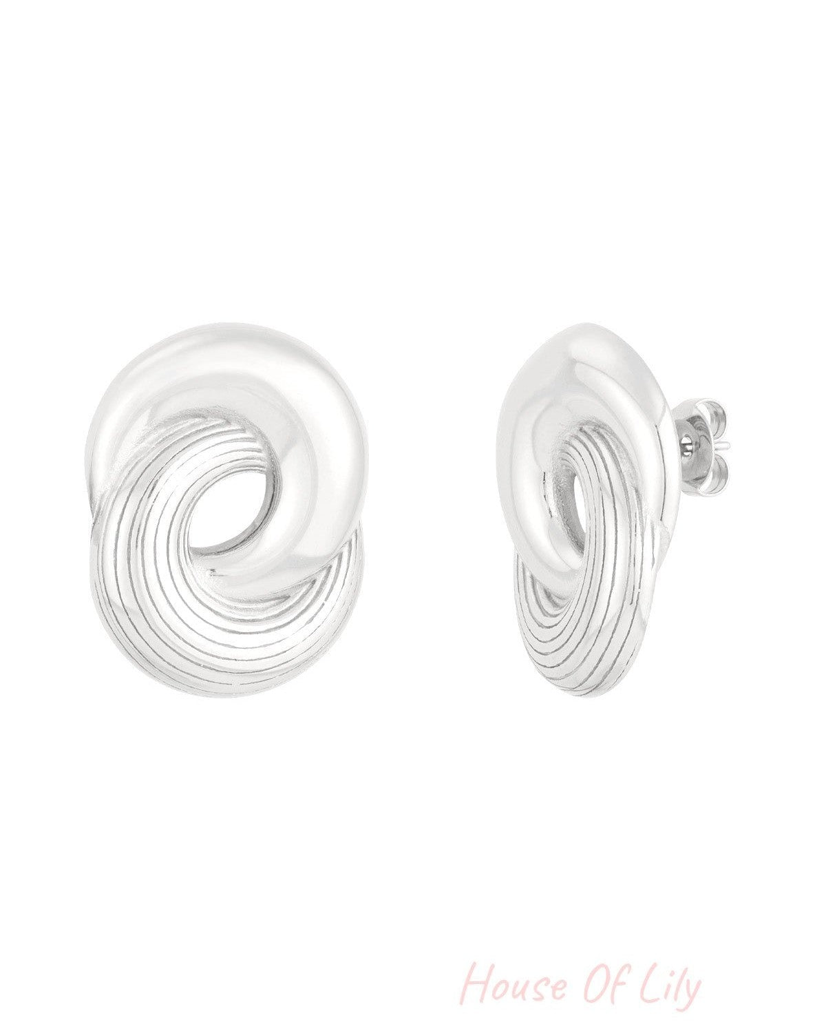 Silver twist circle stud earrings displayed side by side showing sleek twisted circle design