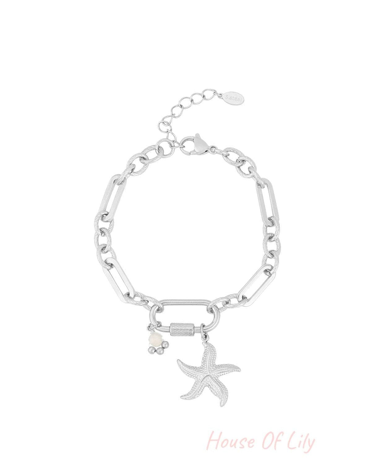 Silver starfish charm bracelet with textured and elongated links on white background