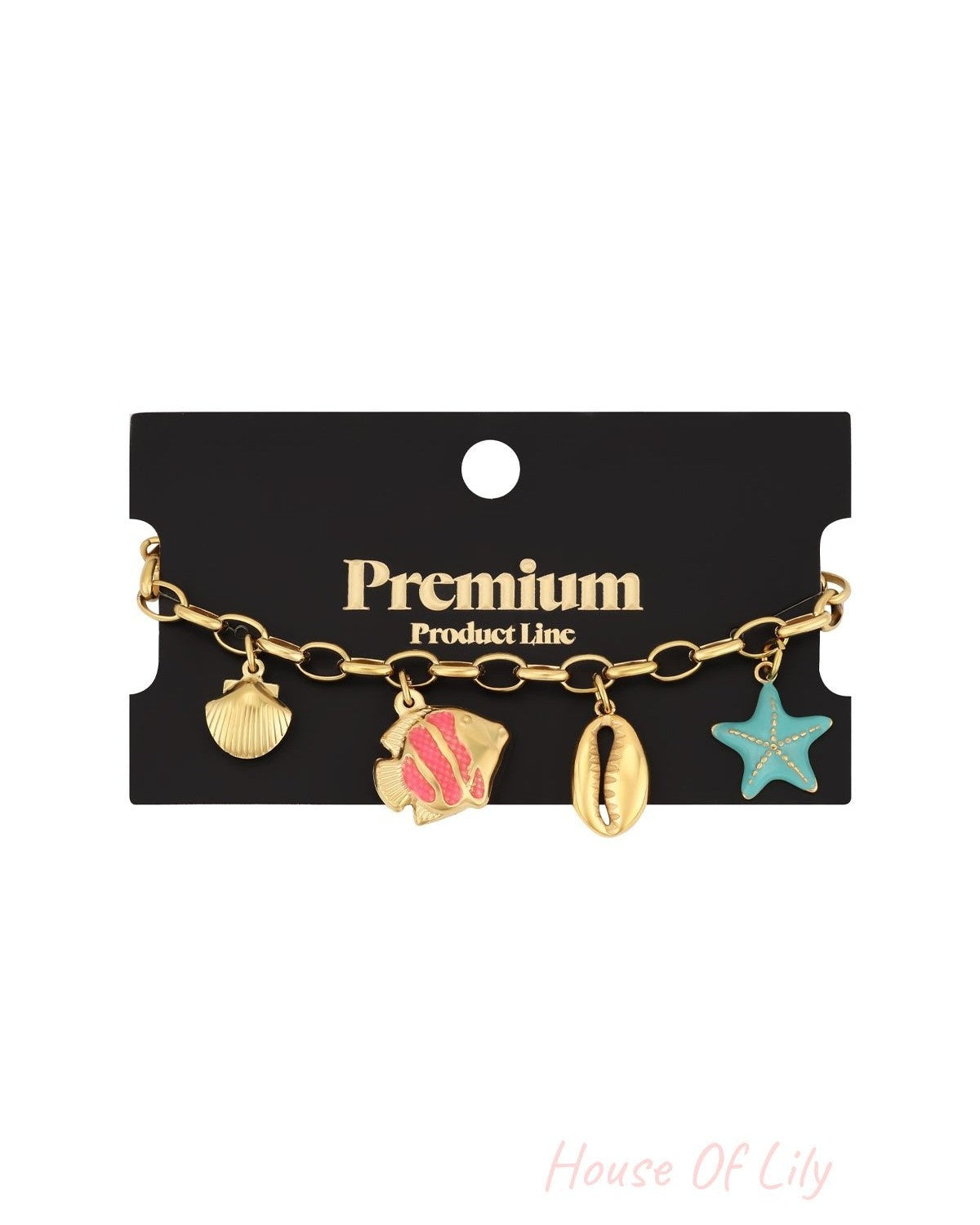 Charm bracelet attached to black Premium Product Line packaging, showcasing gold-tone sea-themed charms