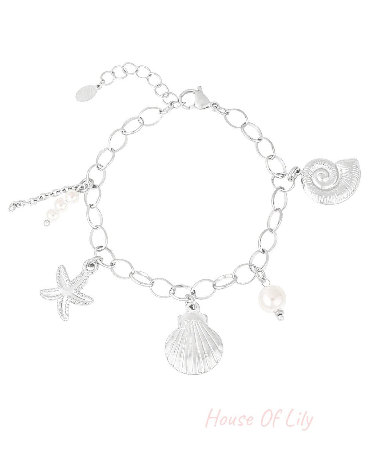Sculpted Muse silver charm bracelet with seashell, starfish, and pearl charms on a delicate oval-link chain.