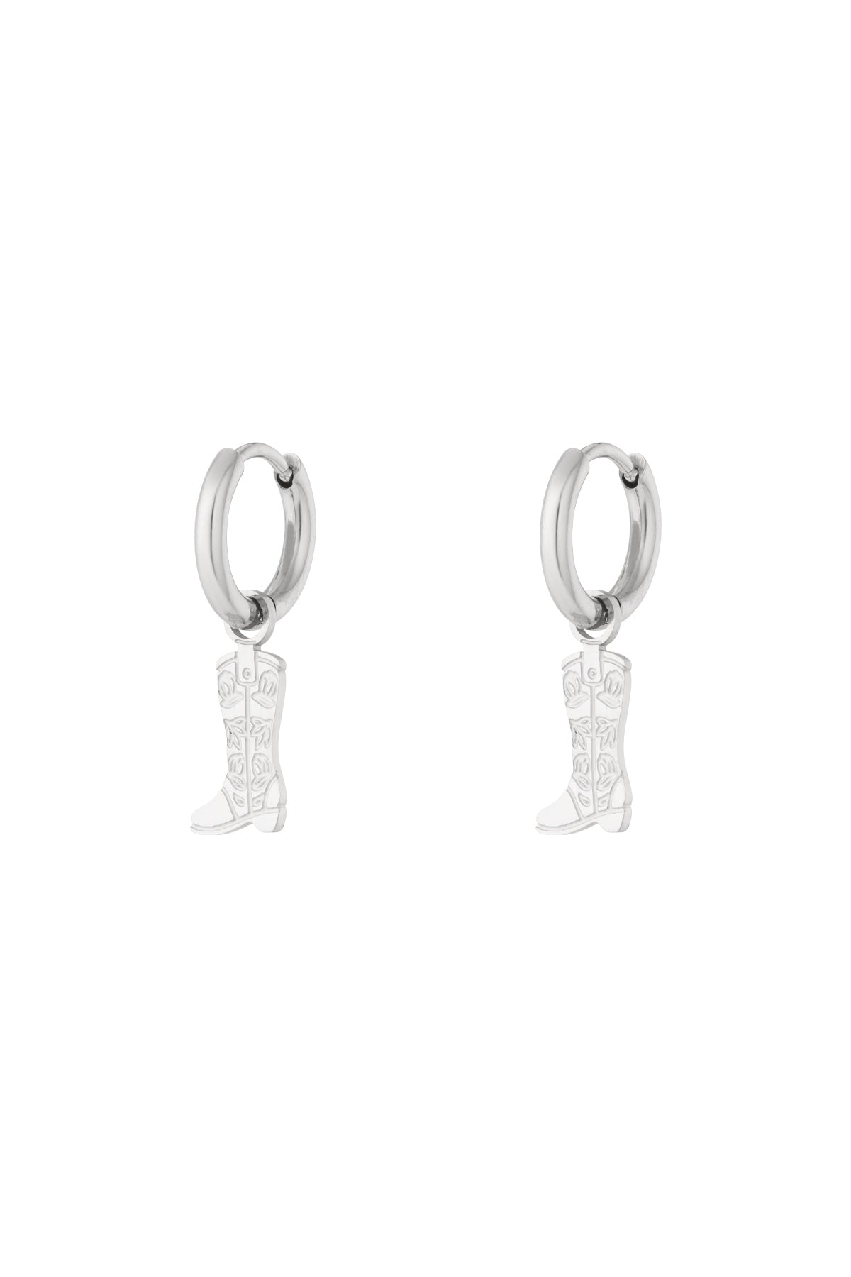 Pair of silver hoop earrings with hanging cowboy boot charms featuring floral detail on white background
