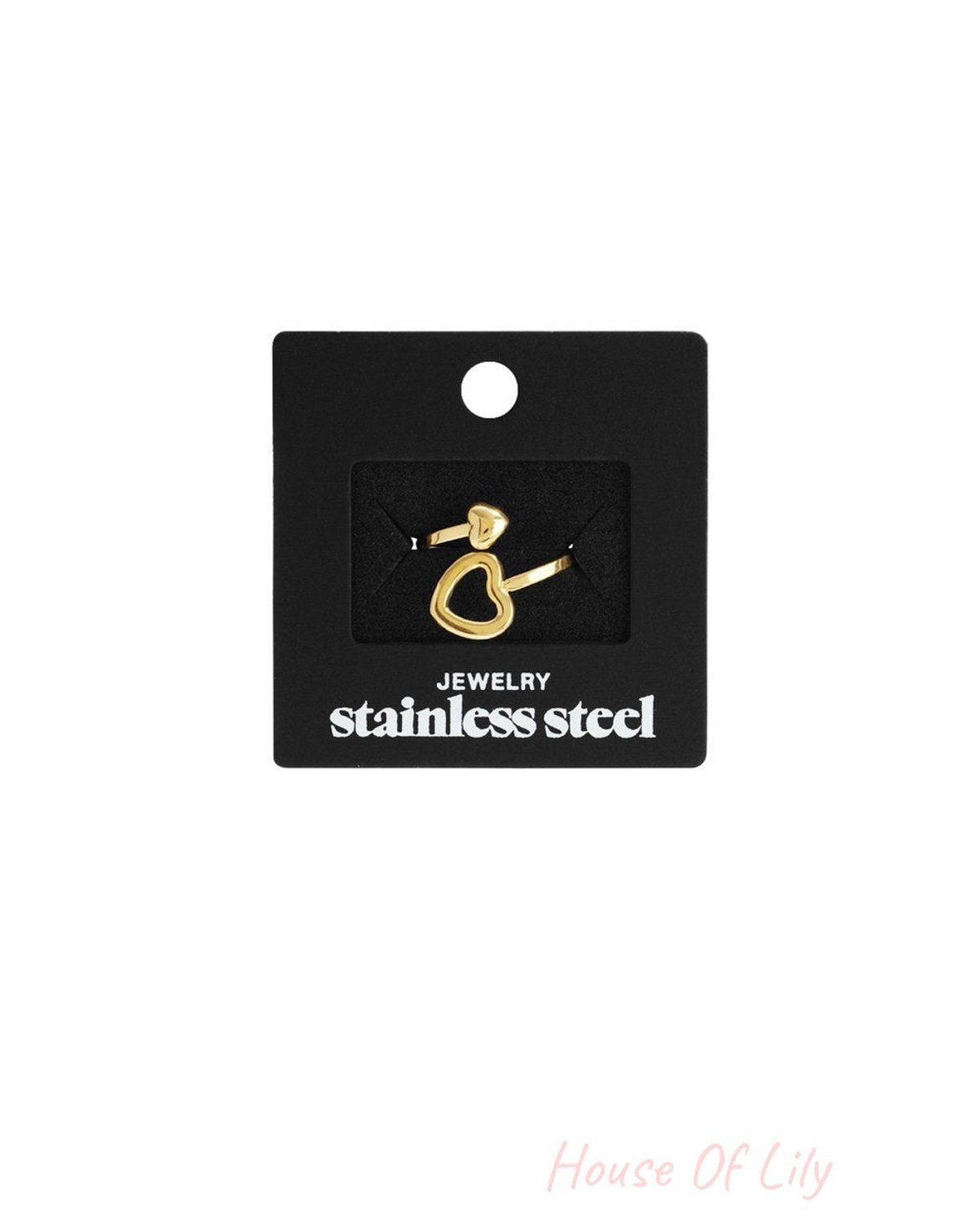 Gold-tone stainless steel split heart mood ring on a black display card.