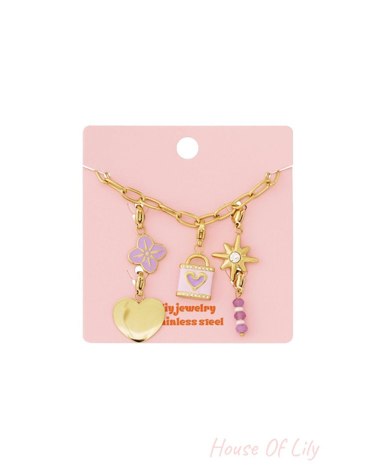 Polished gold link charm bracelet featuring flower, heart, padlock, and star charms with purple enamel and bead accents.