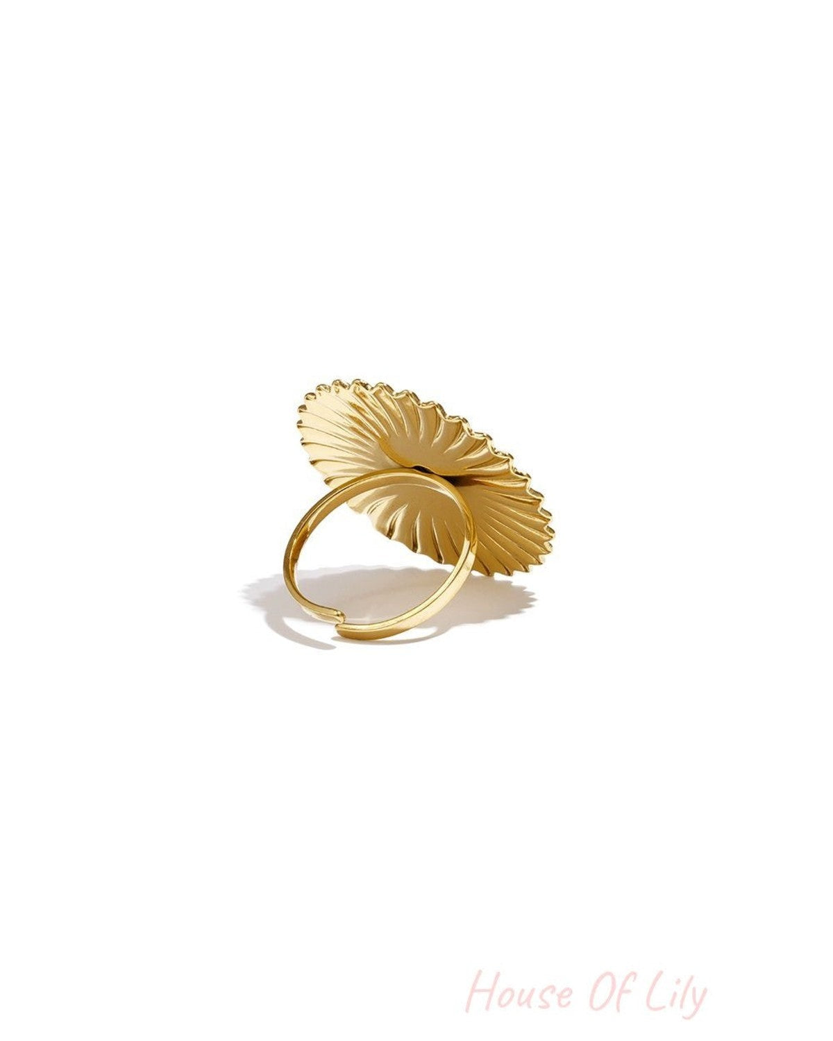 Golden Hour Heart Ring: A polished gold ring featuring a large, sunburst-textured heart motif on a thin band.