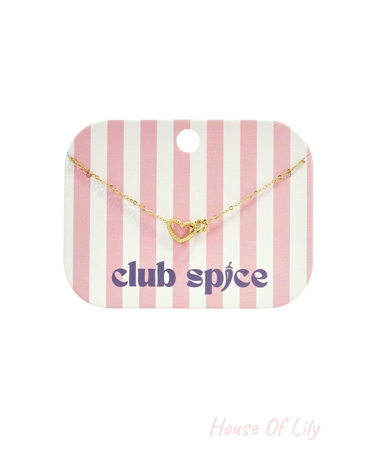Gold heart charm bracelet displayed on pink and white striped Club Spice branded card