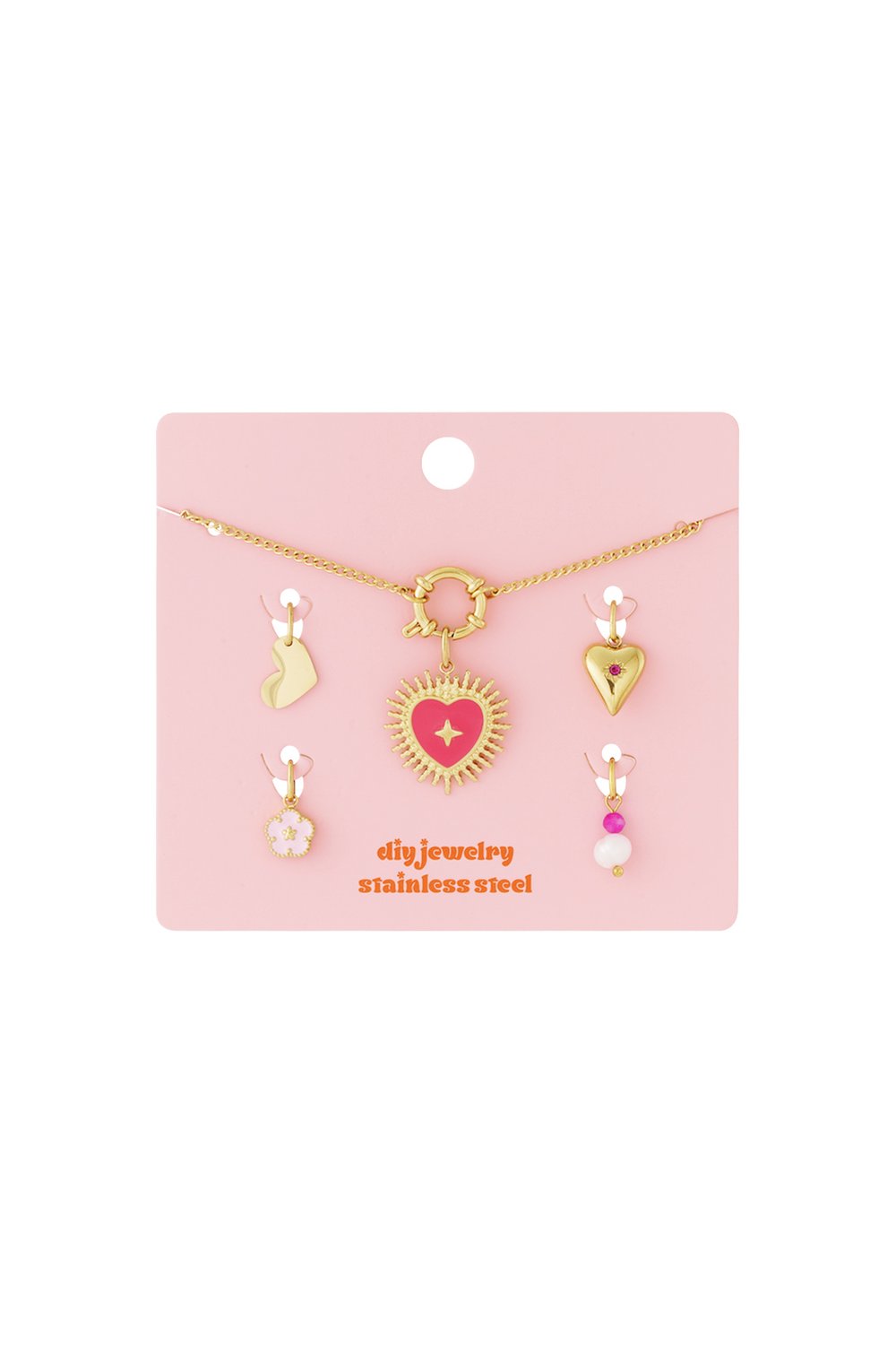 Gold-tone chain DIY jewelry kit with Puffy Heart pendant and four interchangeable charms on a pink display card.