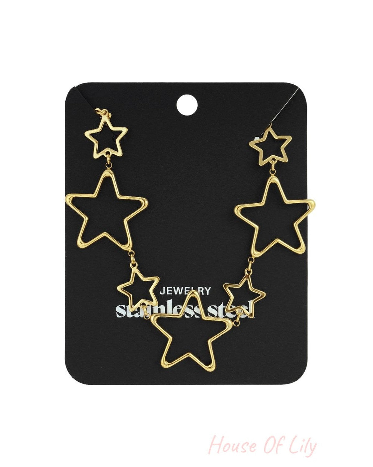 Gold-tone stainless steel necklace featuring multiple open-work star charms of varying sizes on a black display card.
