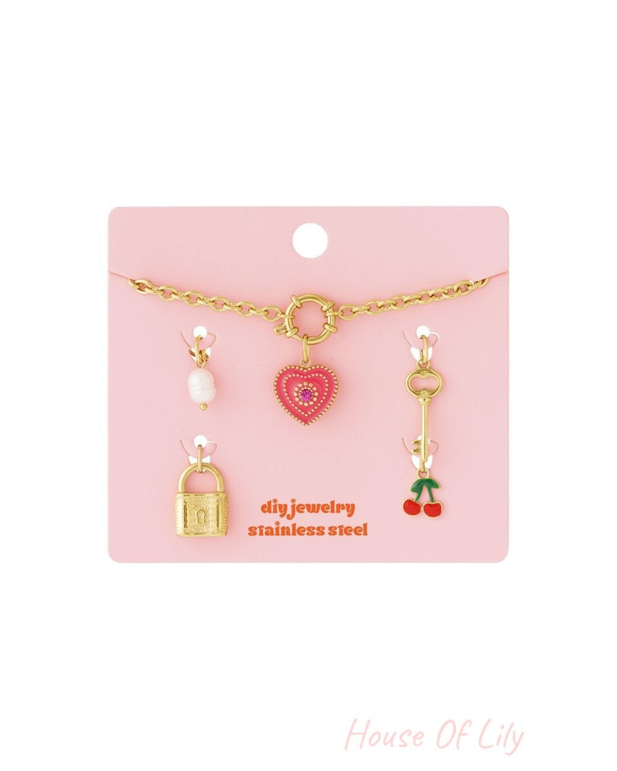 Whimsy Era stainless steel gold-tone chain necklace set with pearl, heart, key, padlock, and cherry charms.