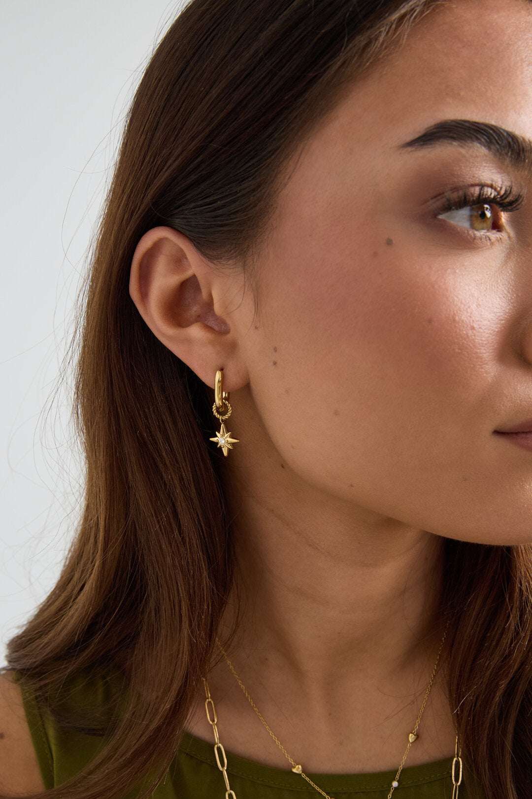Earrings with shooting star on a small ring
