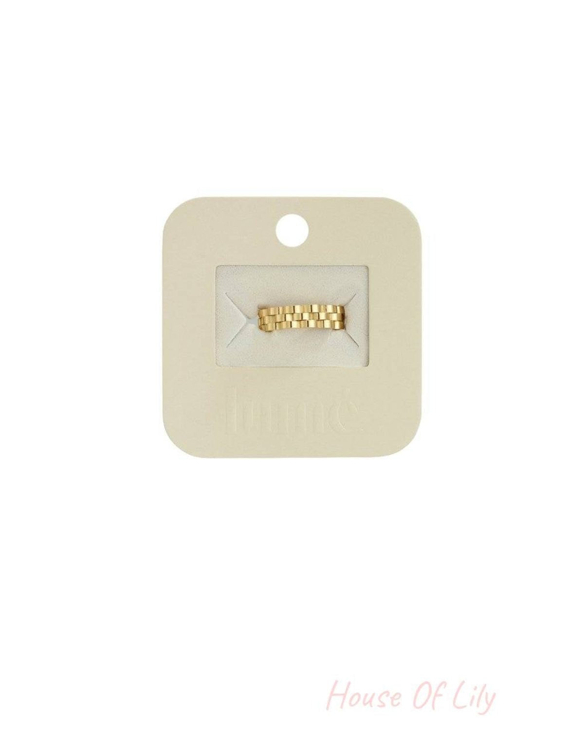 Gold-tone Wavy Drip Ring featuring a textured, link-style band on a branded beige jewelry display card.