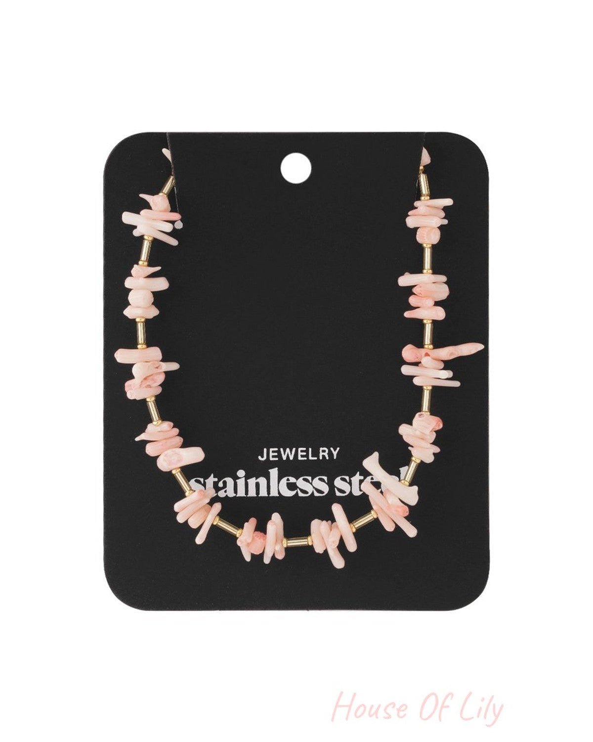 Pink coral chip necklace featuring irregular pastel pink coral beads alternating with thin gold-tone stainless steel tubes.