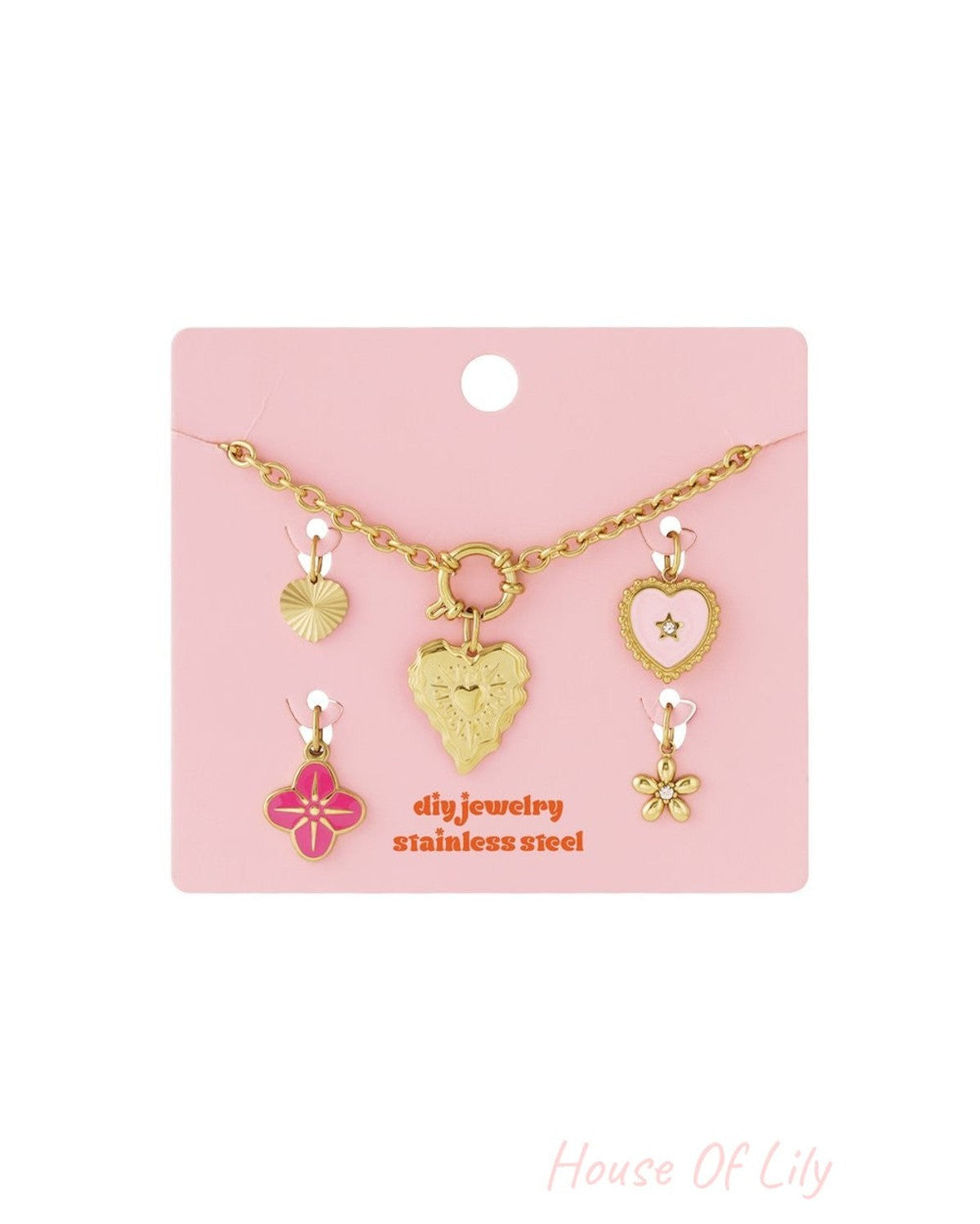 Golden Era Core: Gold stainless steel charm necklace kit with pink and gold heart, star, and flower pendants on a card.