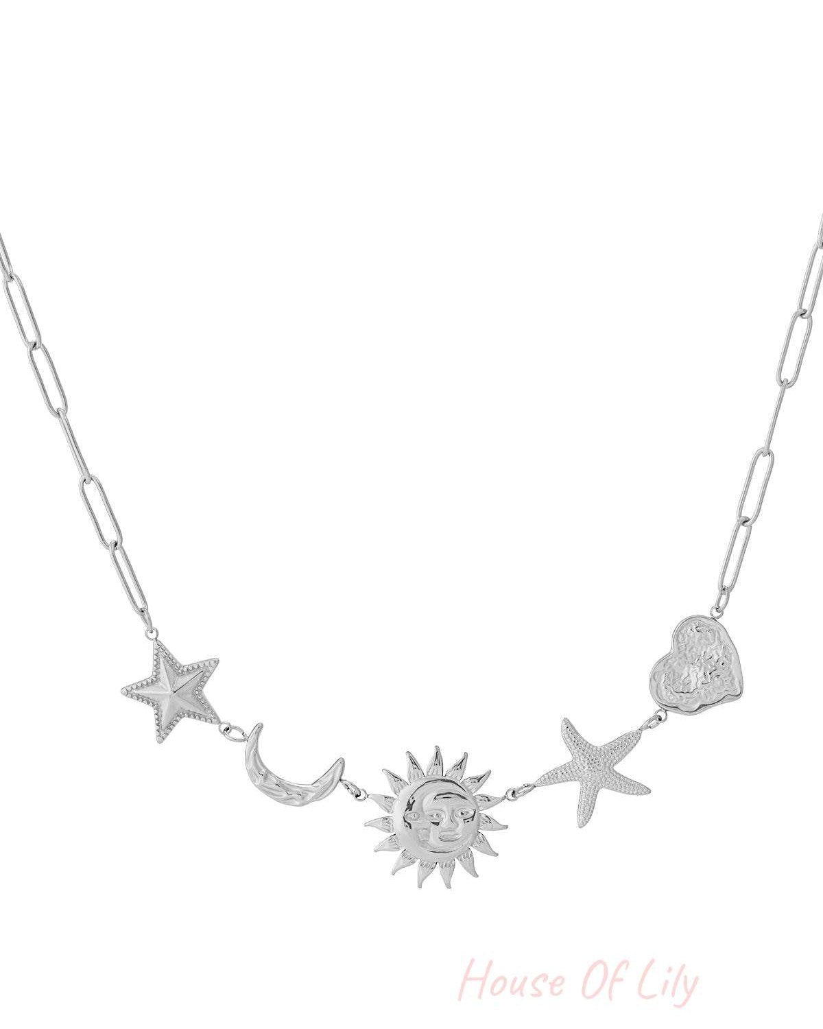 Silver pendant necklace featuring star, crescent moon, sun, starfish, and heart charms on elongated chain