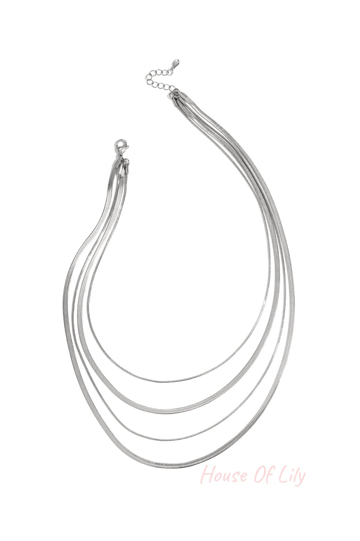 Four-strand silver layered necklace on white background with lobster clasp