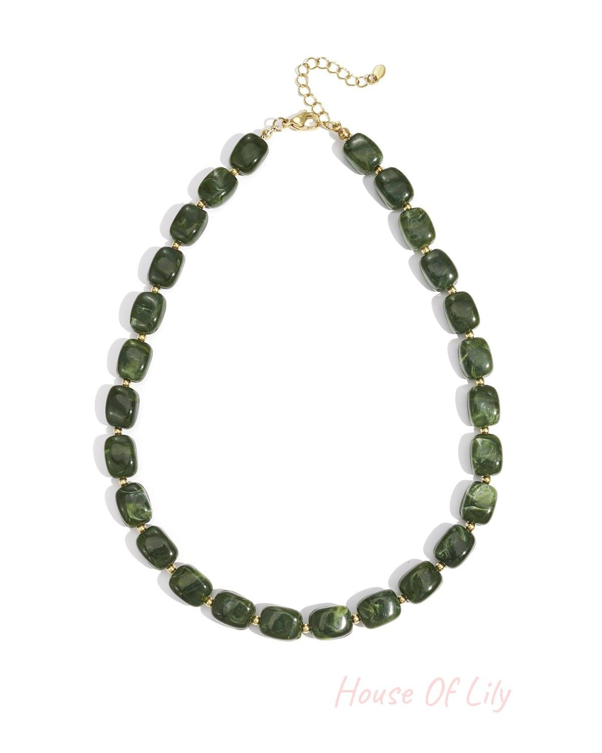 Necklace with polished, marbled forest green rectangular beads separated by small gold spacers on a gold chain.