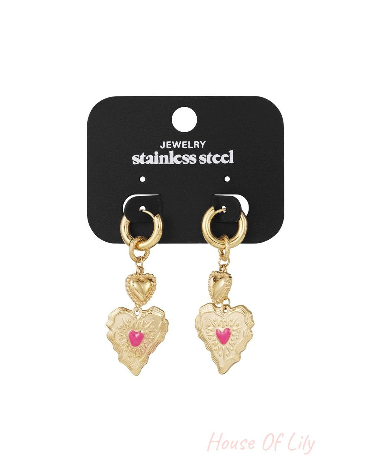 Gold stainless steel hoop earrings featuring sculpted heart charms with a small pink enamel heart inlay.