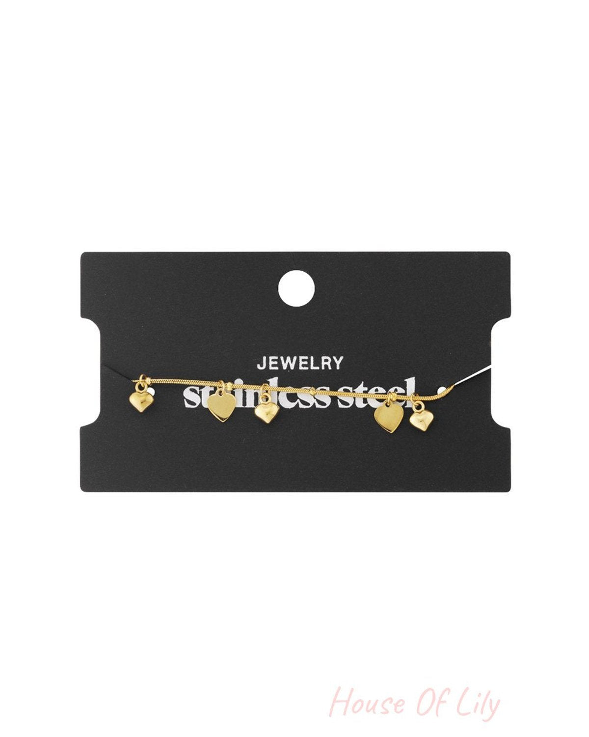 Gold-tone stainless steel dainty chain bracelet featuring five small, polished heart-shaped charms.