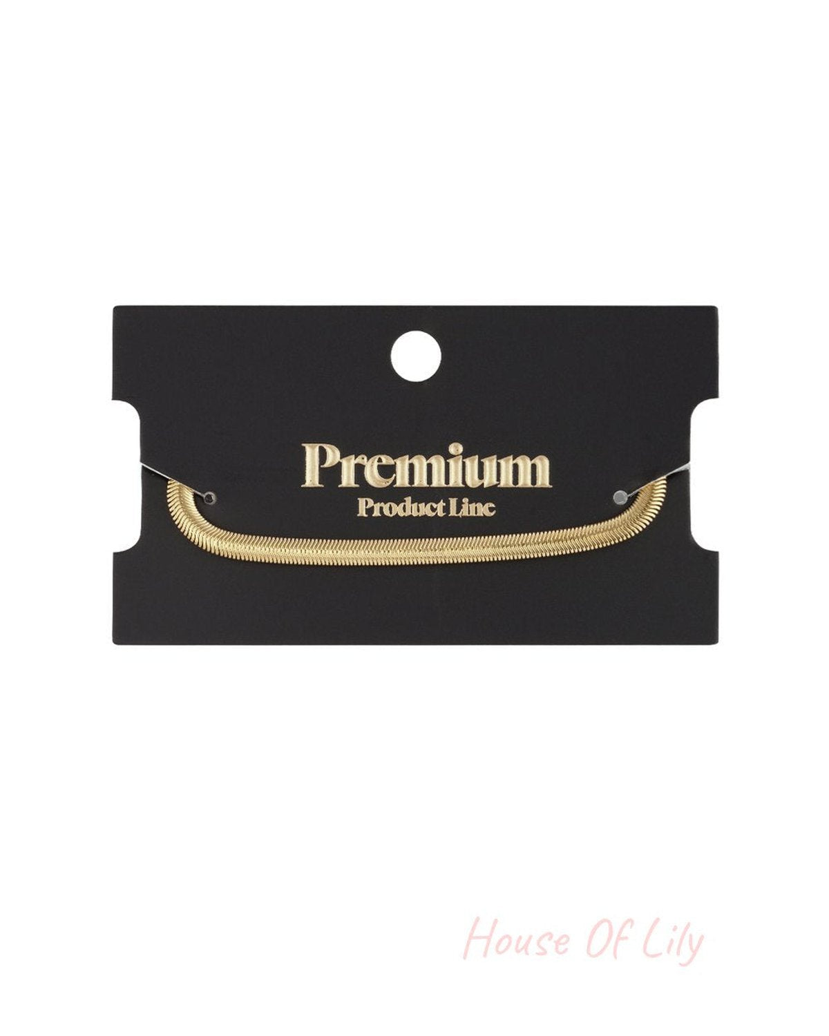 Sleek gold-toned flat herringbone chain bracelet displayed on a black "Premium Product Line" display card.
