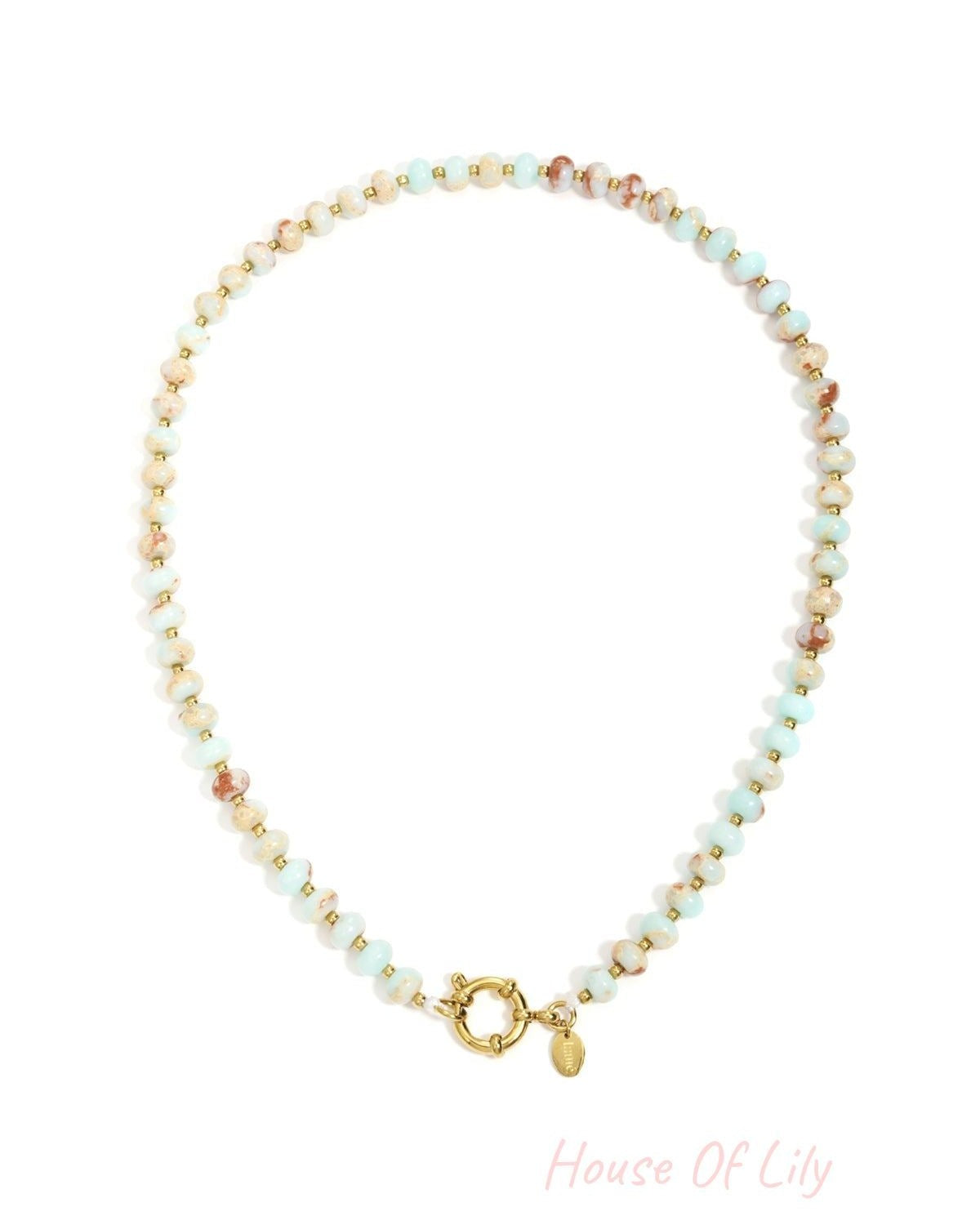 Beaded necklace with light blue and marbled stone beads, separated by small gold spacers, featuring a gold spring clasp.