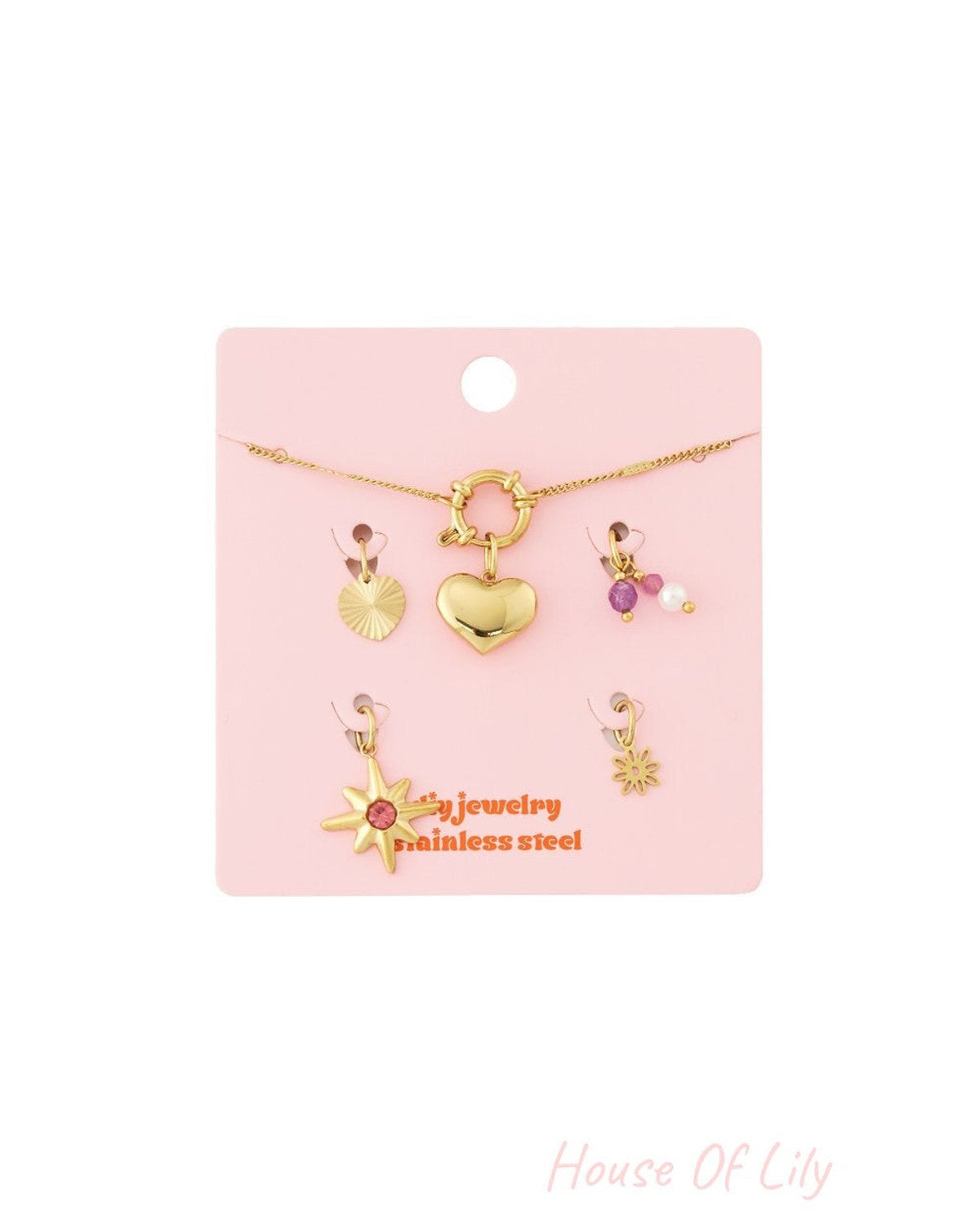 Gold-toned stainless steel heart link bracelet with removable charms including a star, heart, and pearl accents.