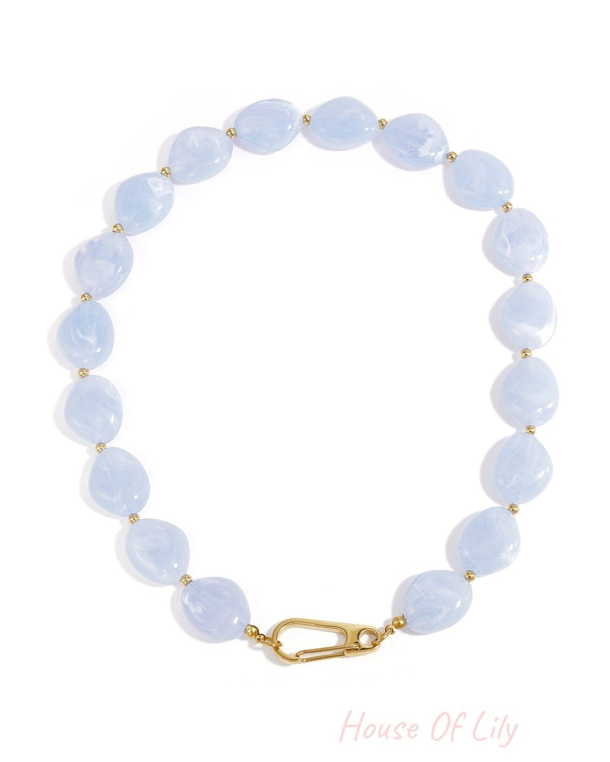 Light blue chunky resin beaded necklace with gold-tone spacers and front clasp shown on white background