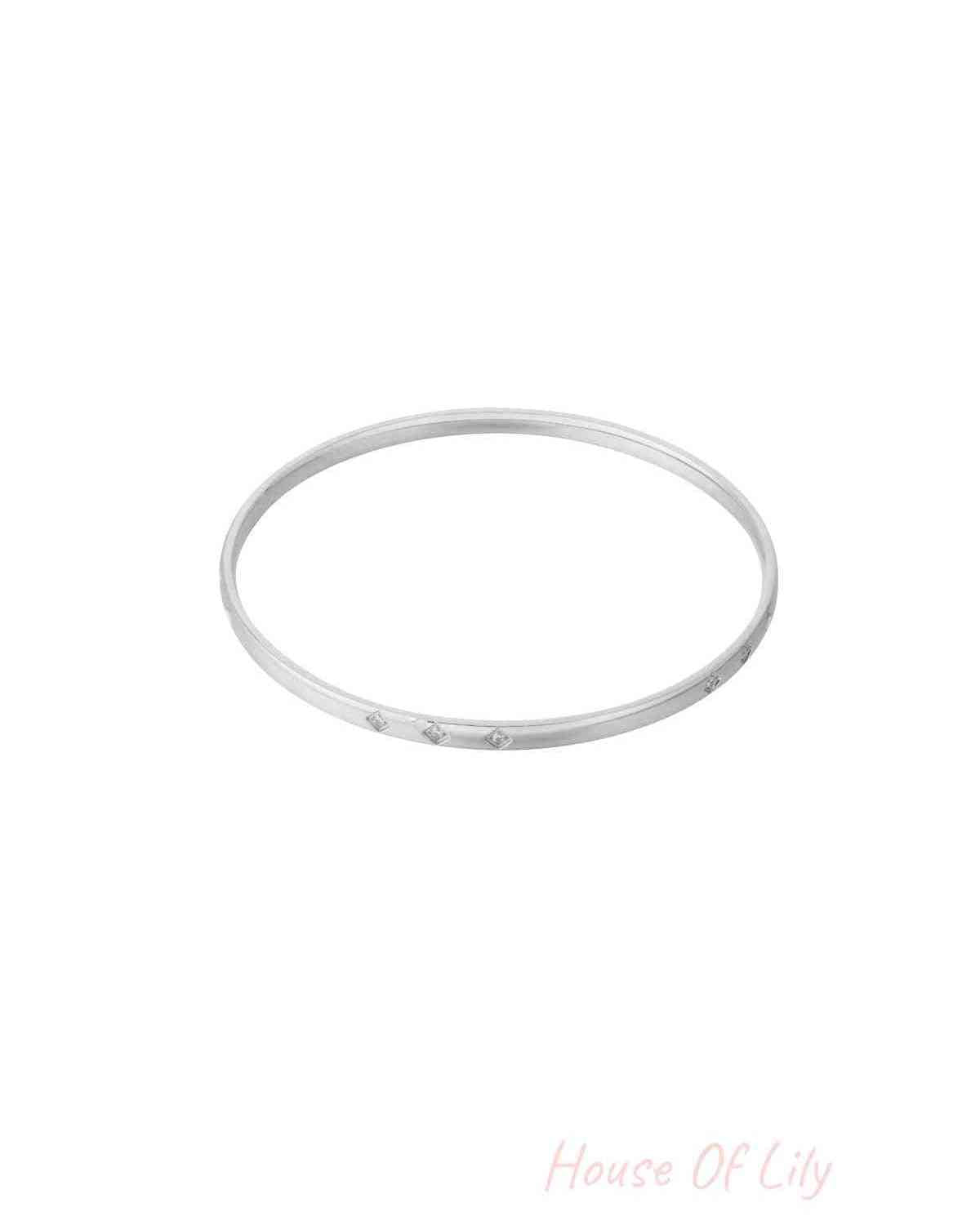 Silver mini diamond bangle with subtle rhinestone accents shown on white background