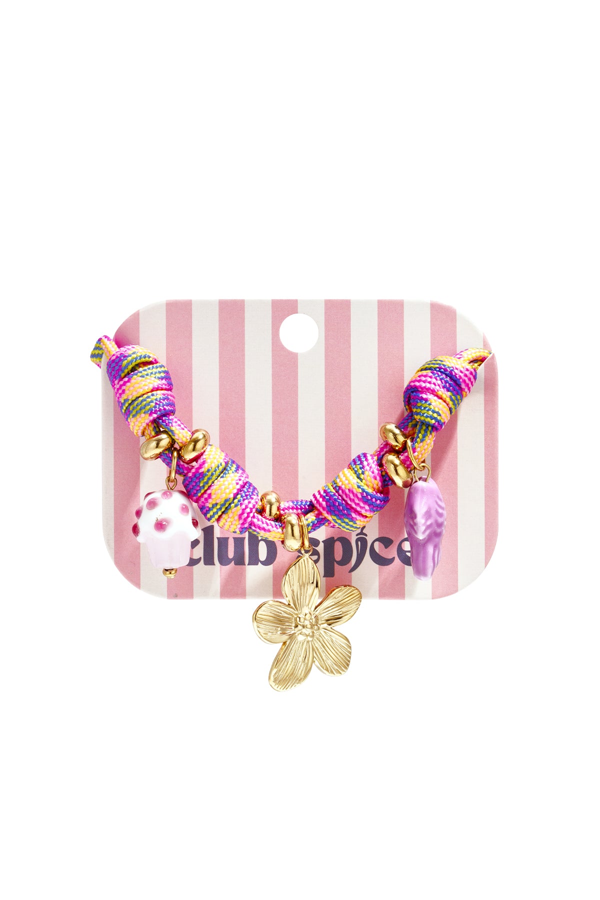 Close-up of multicolor rope charm bracelet with gold flower, cupcake and fish charms displayed on striped pink and white card