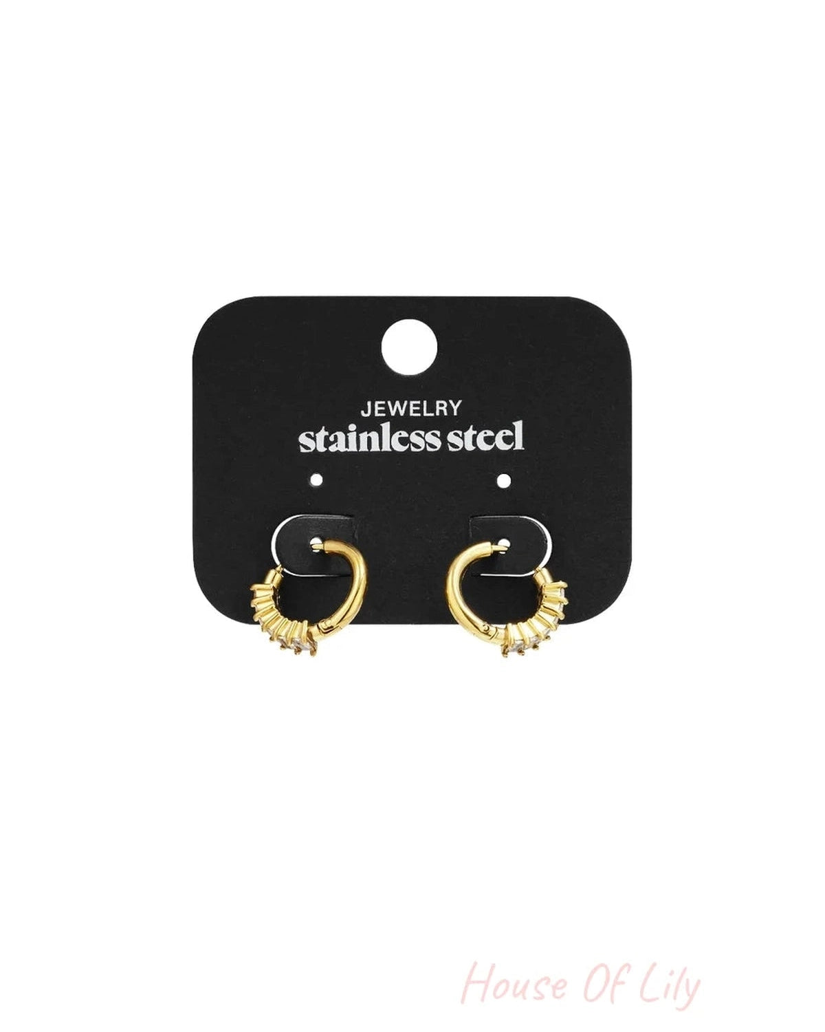 Gold-tone stainless steel hoop earrings featuring a partial row of baguette-cut crystals on a black display card.