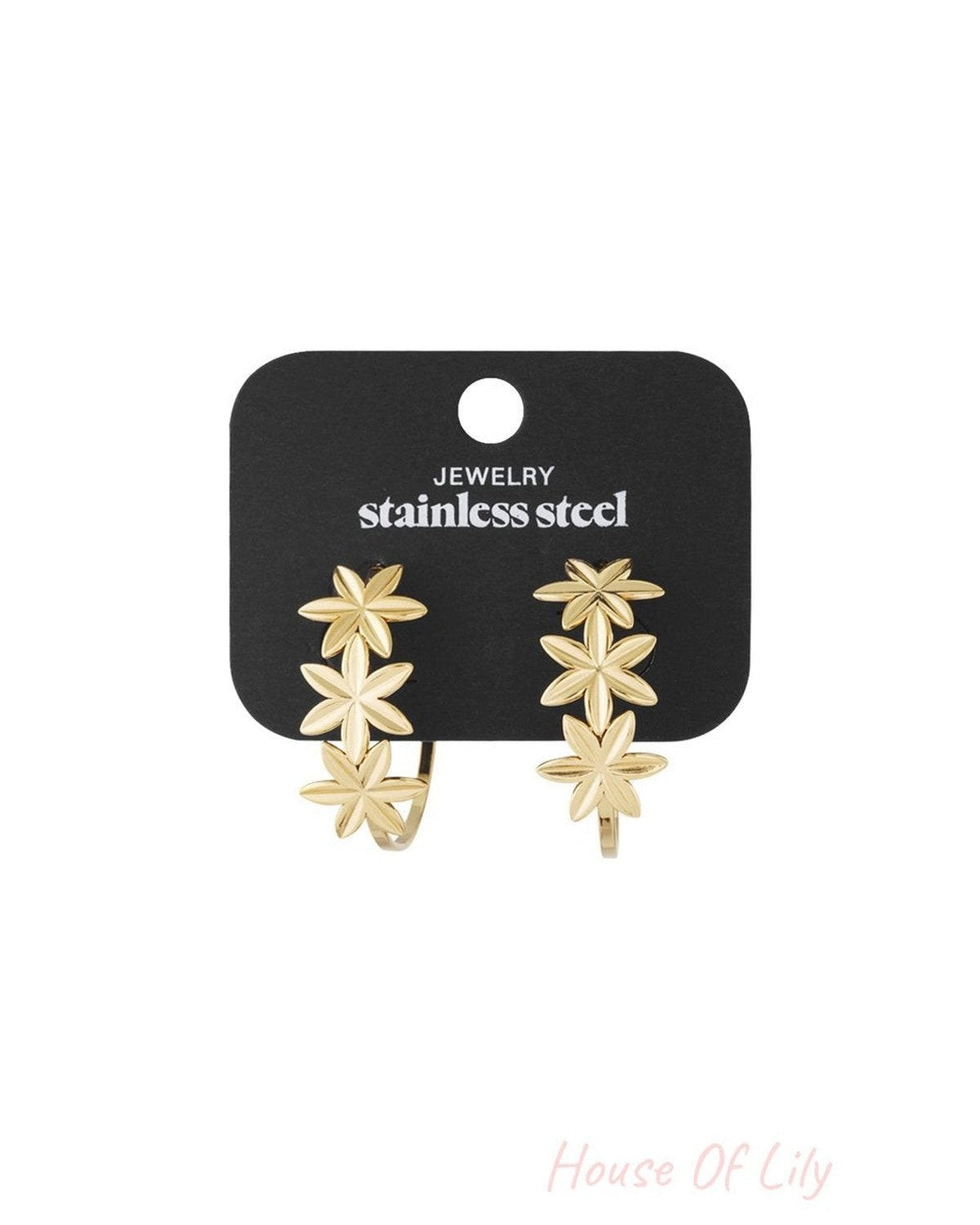 Petal Dream gold stainless steel hoop earrings featuring a trio of floral-shaped accents on each piece.