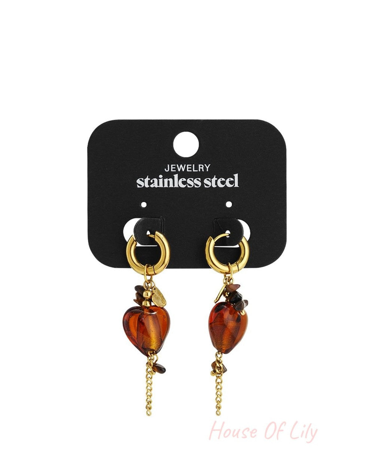 Gold stainless steel hoop earrings featuring dangling amber-colored heart charms and delicate accent chains.