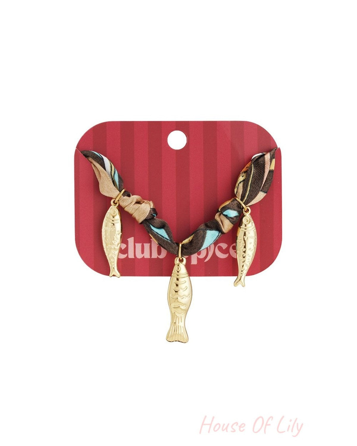 Silk bangle featuring three gold fish charms on a brown, blue, and beige patterned fabric strap.