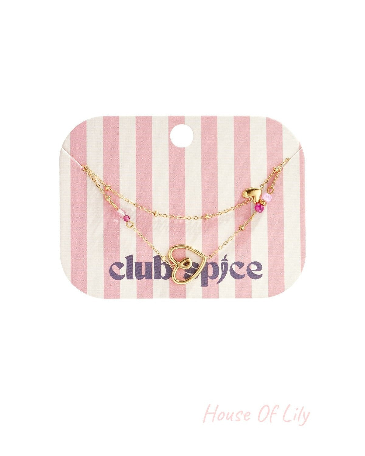Delicate heart charm bracelet displayed on pink and white striped Club Spice branded packaging card