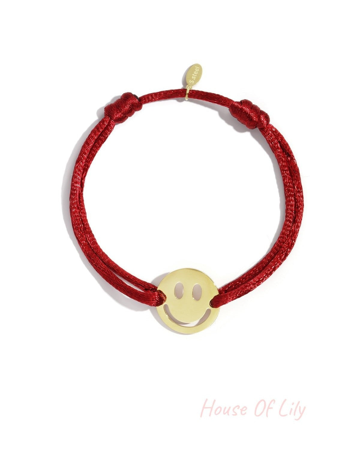 Cheerful Smiley Face bracelet: gold-tone smiley face charm on a vibrant red cord with adjustable sliding knots.