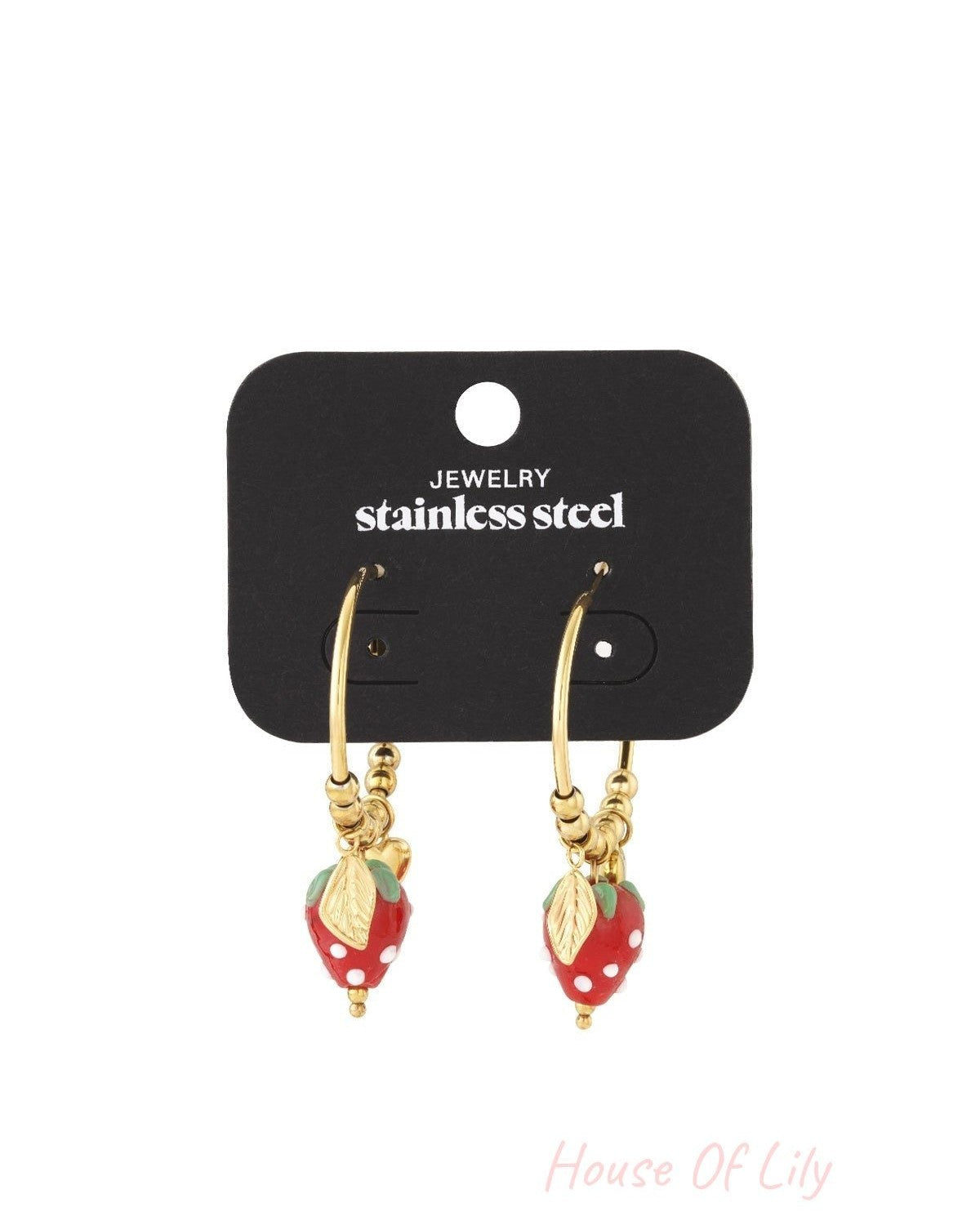 Gold hoop earrings on a display card featuring dangling red strawberry charms with gold leaves.