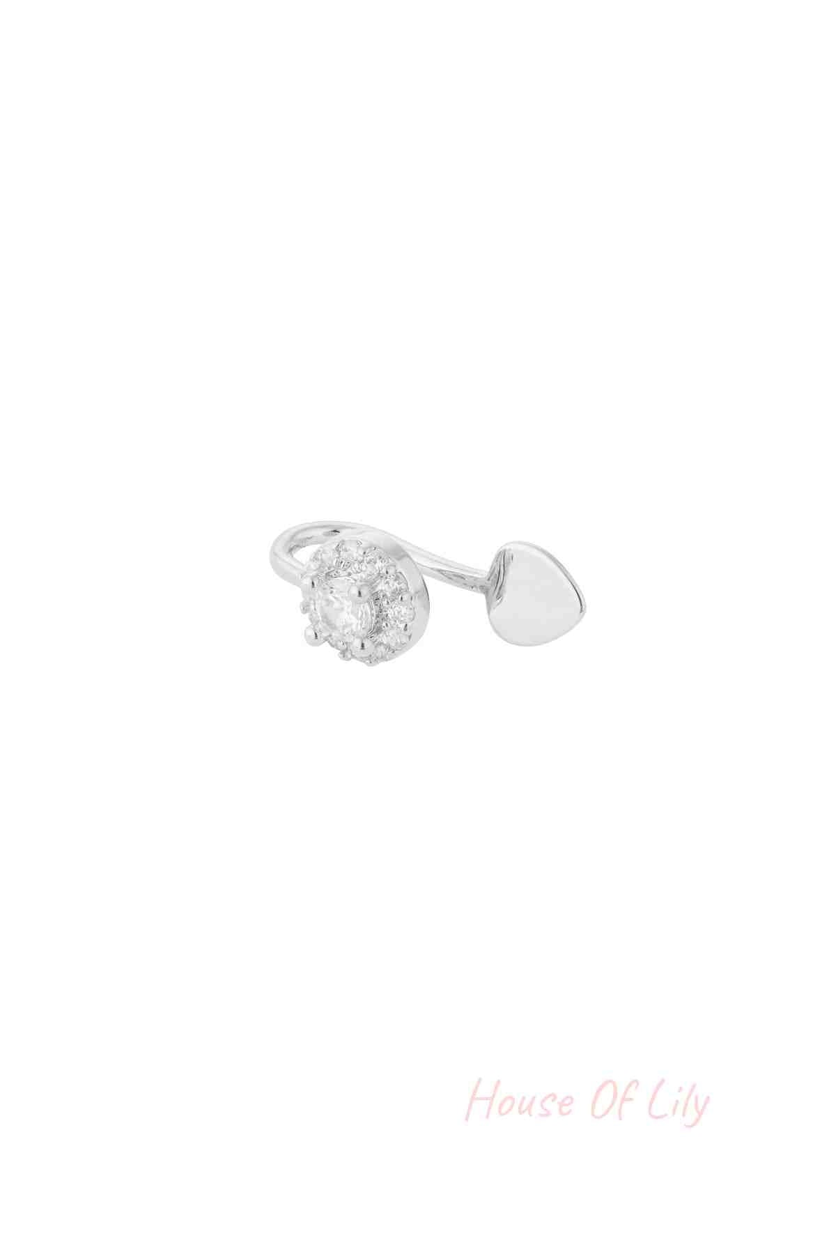 Silver ear and nose cuff featuring a heart and cubic zirconia-studded circle on a white background
